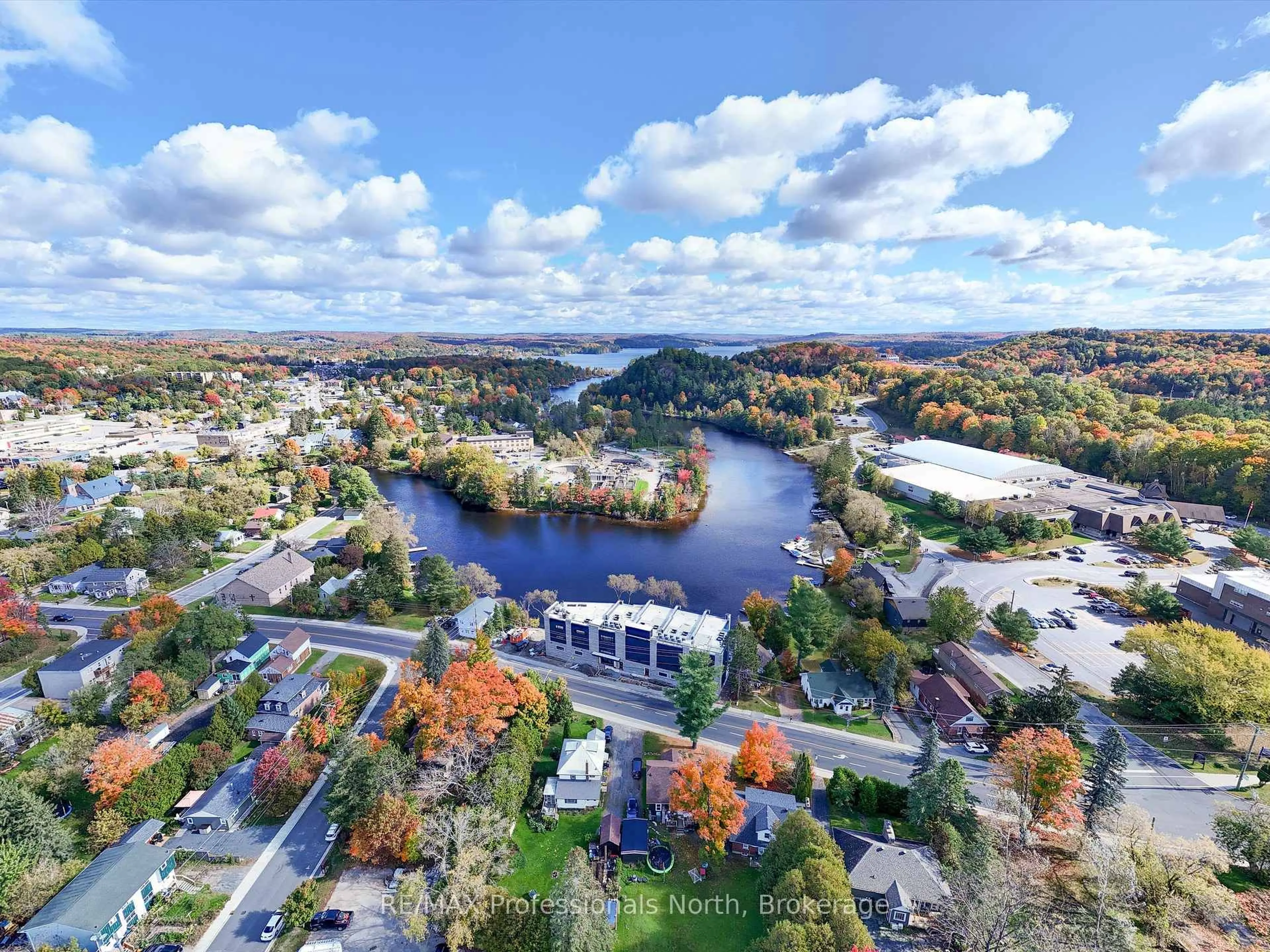 A pic from outside/outdoor area/front of a property/back of a property/a pic from drone, water/lake/river/ocean view for 32 BRUNEL Rd #204, Huntsville Ontario P1H 1P5