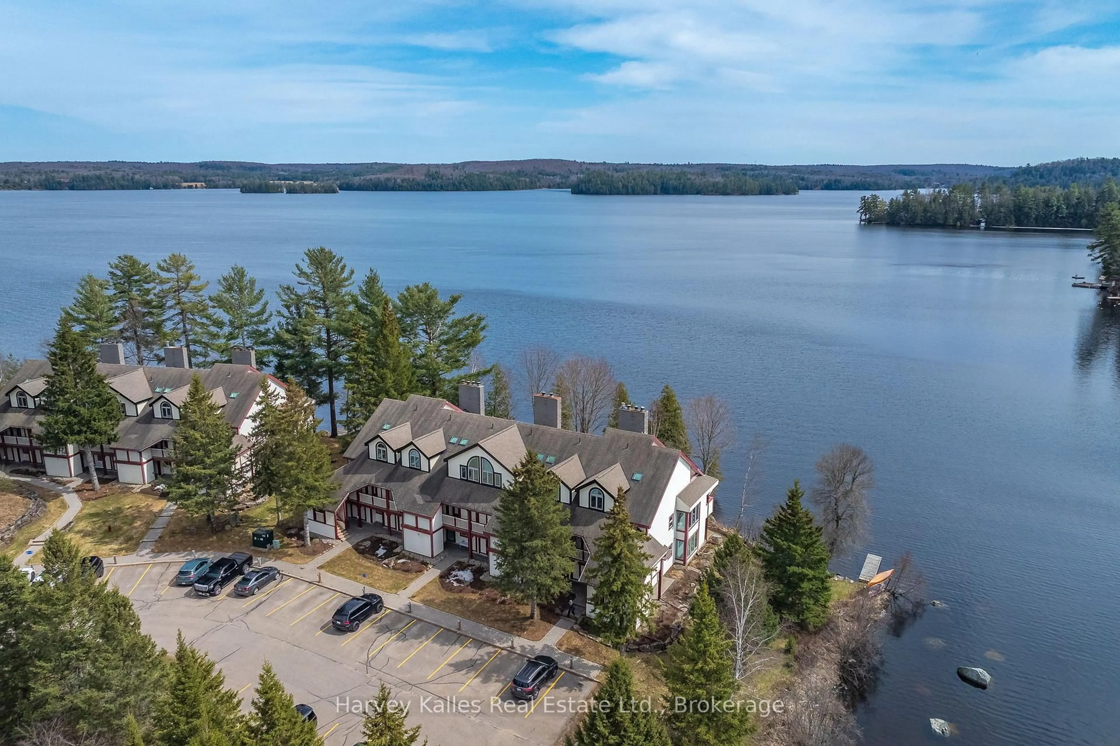 A pic from outside/outdoor area/front of a property/back of a property/a pic from drone, water/lake/river/ocean view for 10 Coveside Dr #204, Huntsville Ontario P1H 1C3