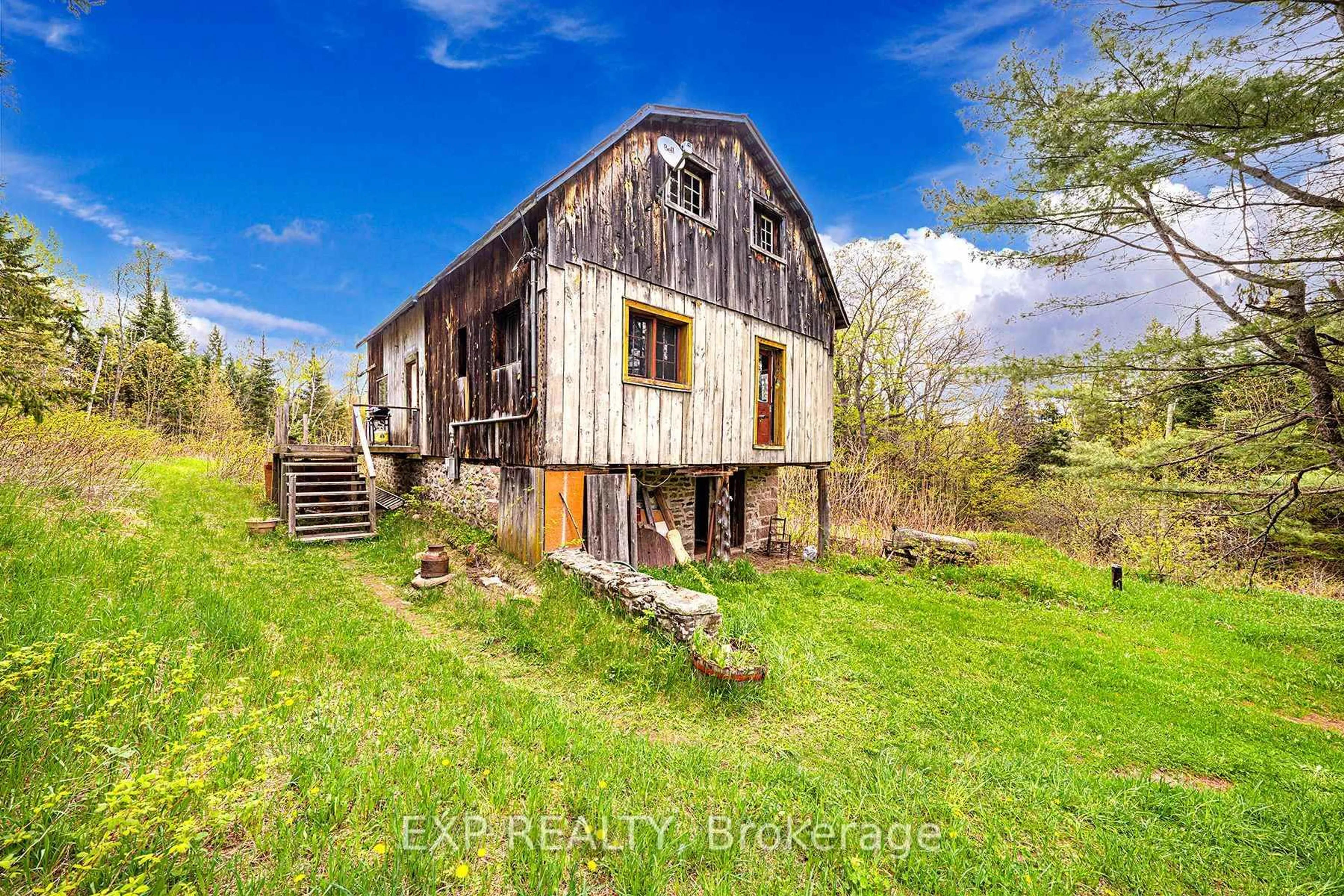 A pic from outside/outdoor area/front of a property/back of a property/a pic from drone, building for 1057 Macduff Rd, Highlands East Ontario K0L 2Y0