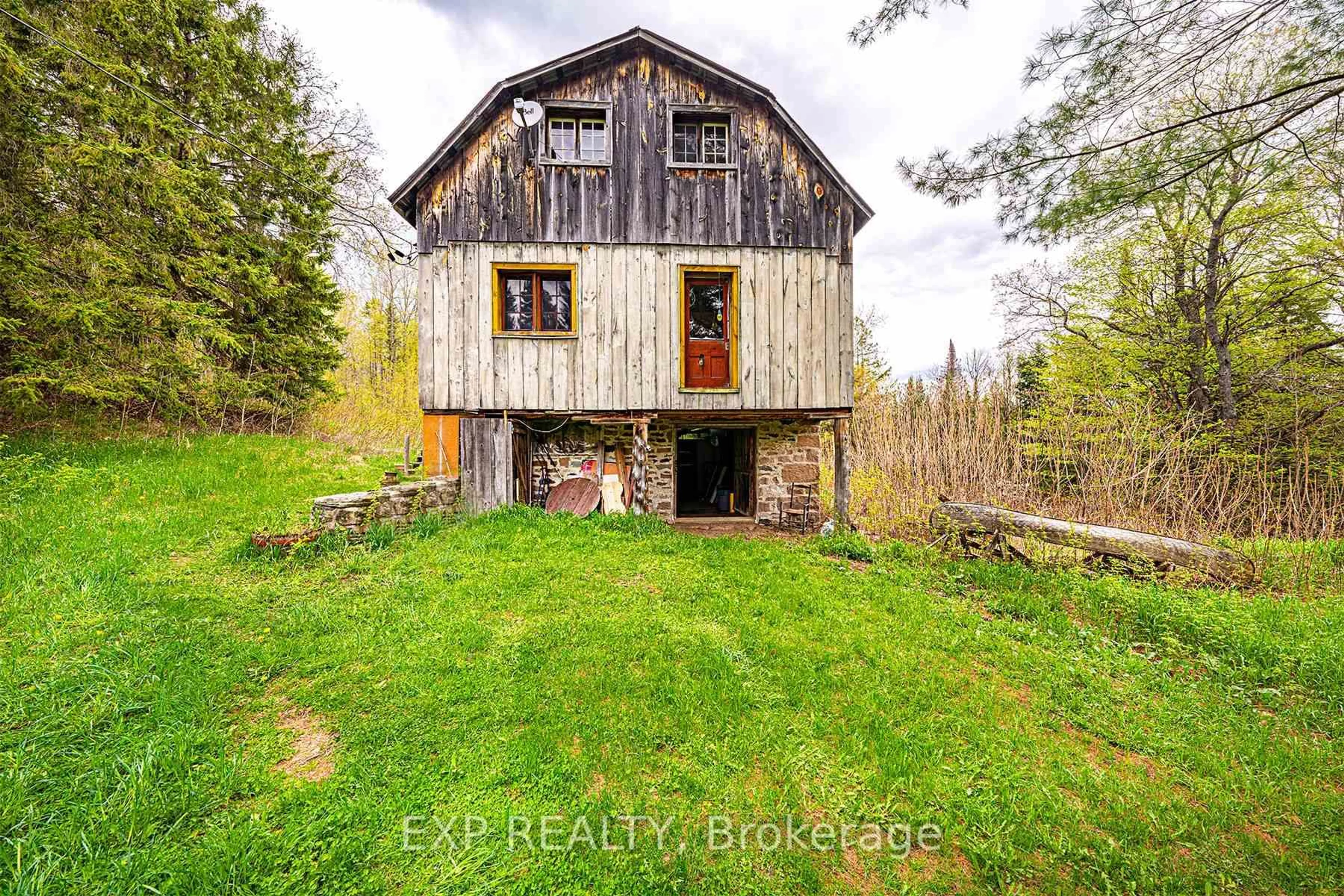A pic from outside/outdoor area/front of a property/back of a property/a pic from drone, building for 1057 Macduff Rd, Highlands East Ontario K0L 2Y0
