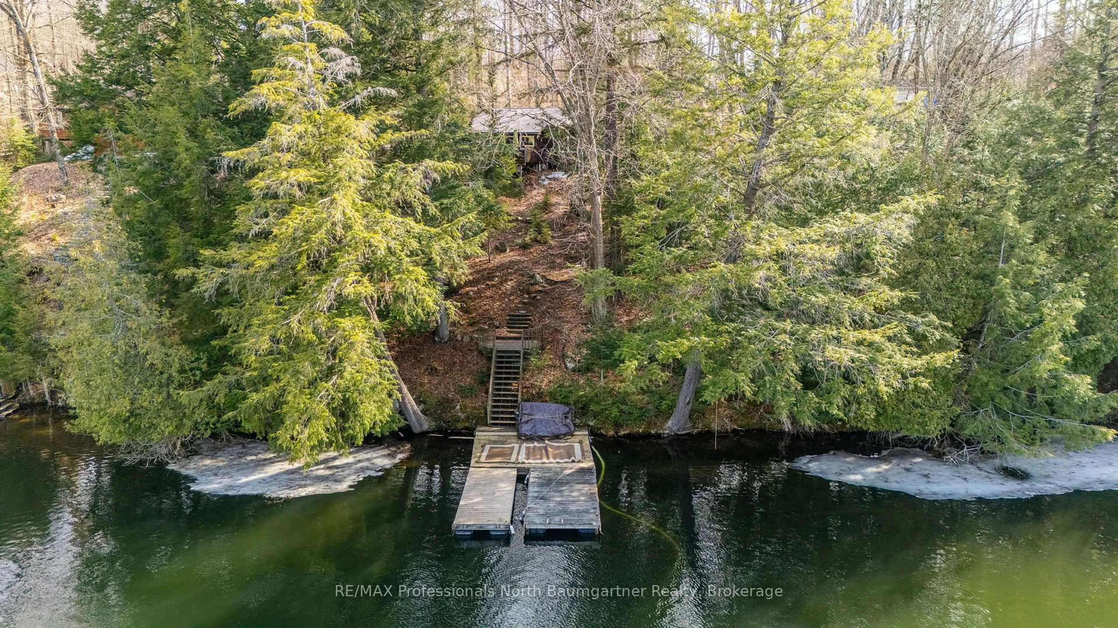A pic from outside/outdoor area/front of a property/back of a property/a pic from drone, water/lake/river/ocean view for 1117 Mink Rd, Dysart et al Ontario K0M 1S0