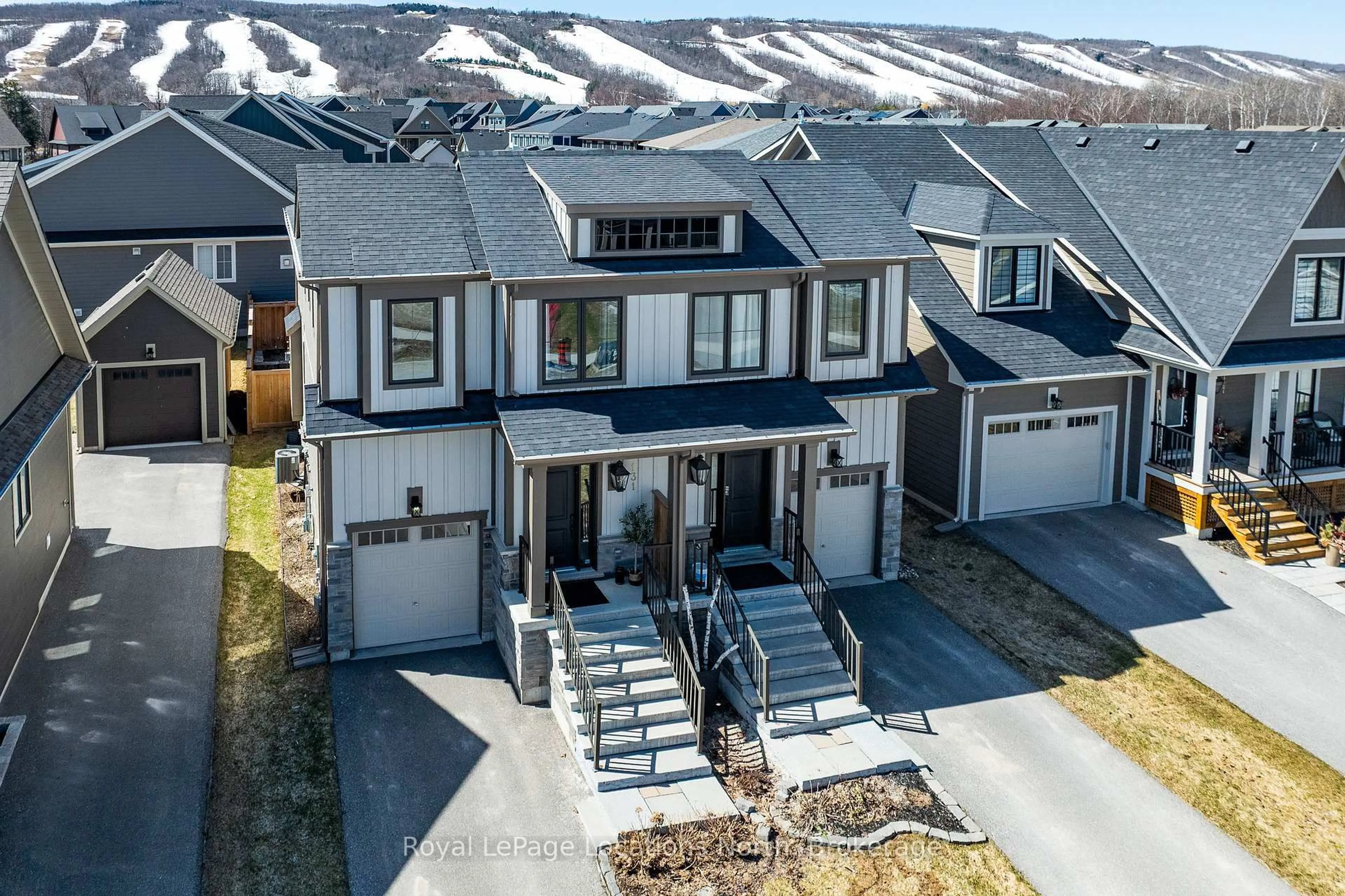A pic from outside/outdoor area/front of a property/back of a property/a pic from drone, mountain view for 131 Red Pine St, Blue Mountains Ontario L9Y 0Z3