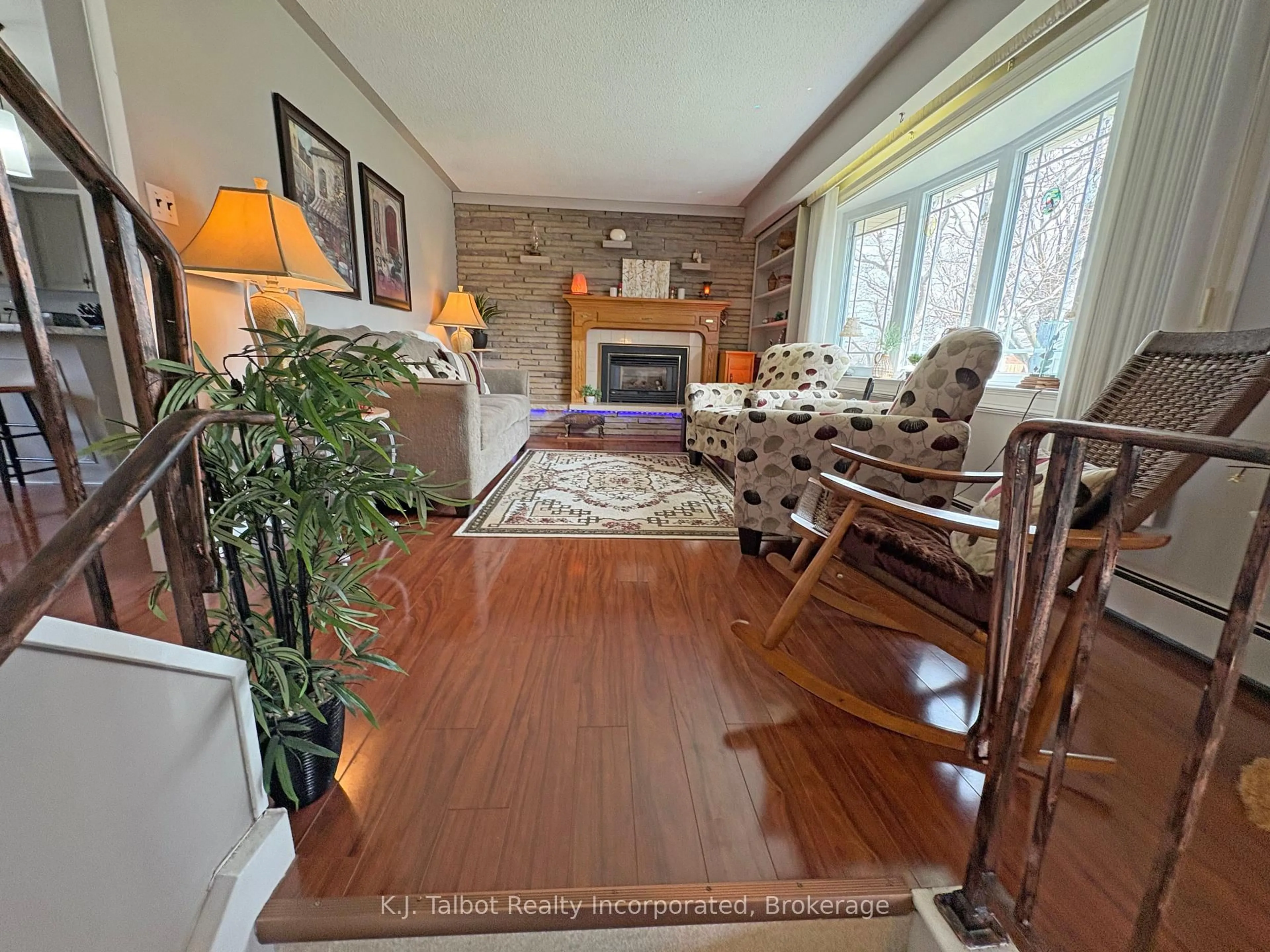Living room with furniture, wood/laminate floor for 208 Palmerston St, Goderich Ontario N7A 3E9