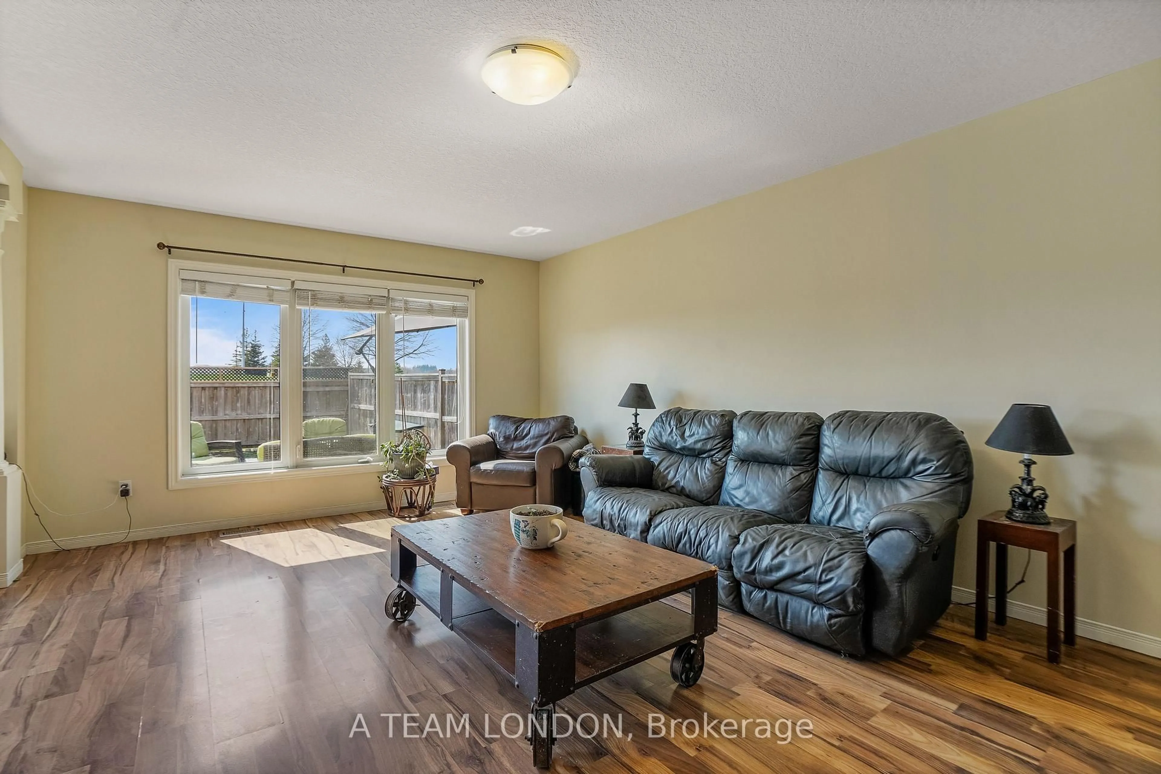 Living room with furniture, wood/laminate floor for 386 Champlain Ave, Woodstock Ontario N4V 0B3