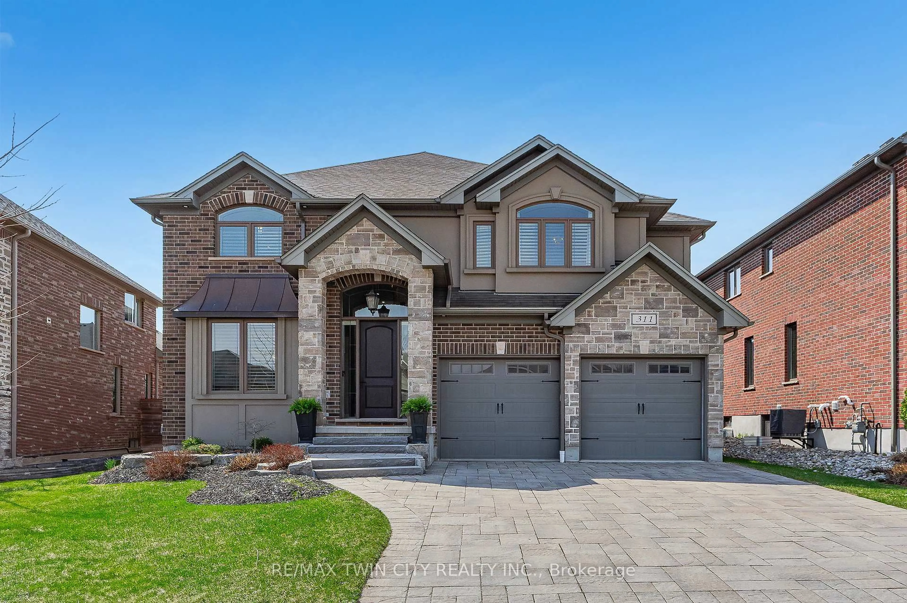Home with brick exterior material, street for 311 Deerfoot Tr, Waterloo Ontario N2K 0B3