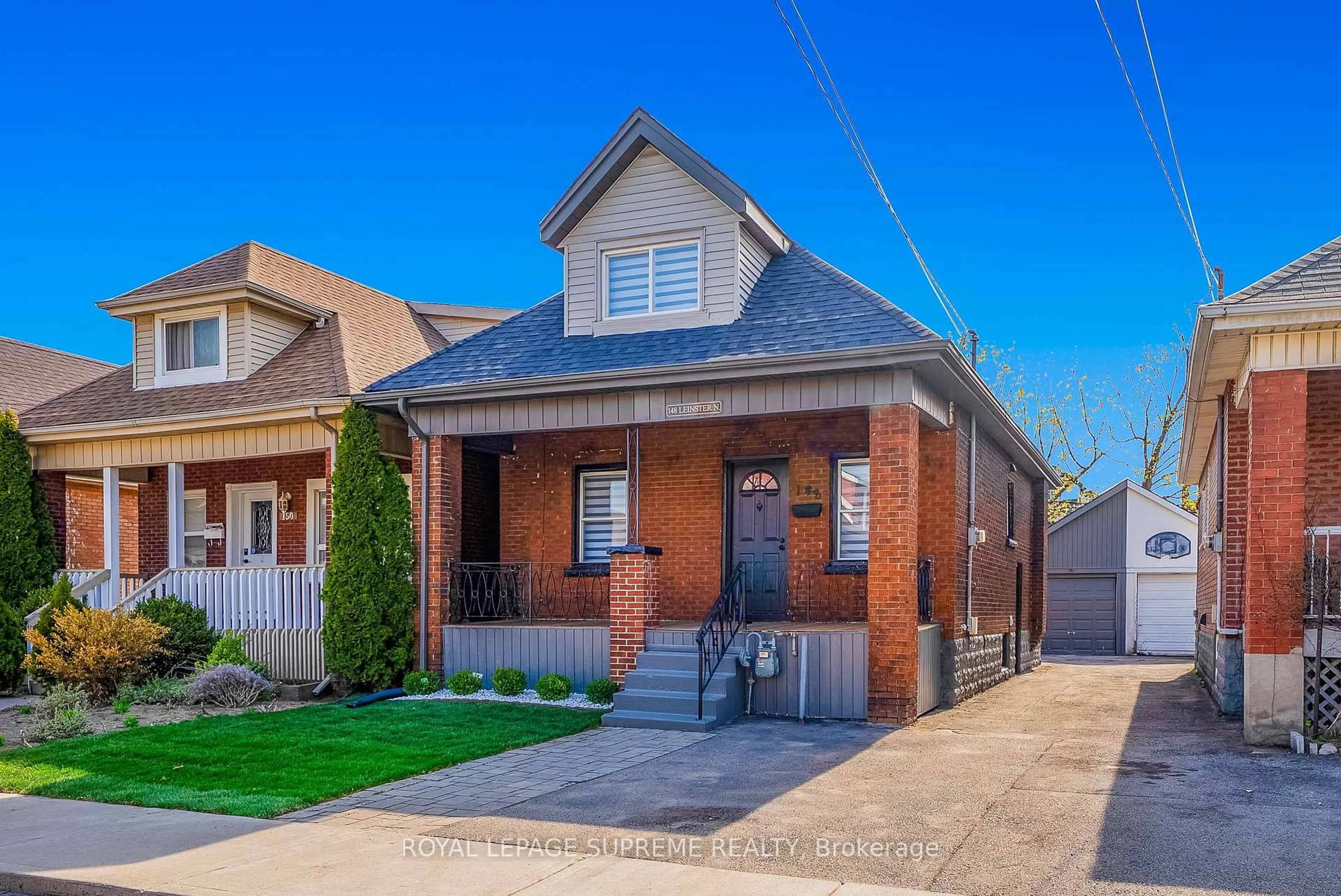 Home with brick exterior material, street for 148 Leinster Ave, Hamilton Ontario L8L 6X9