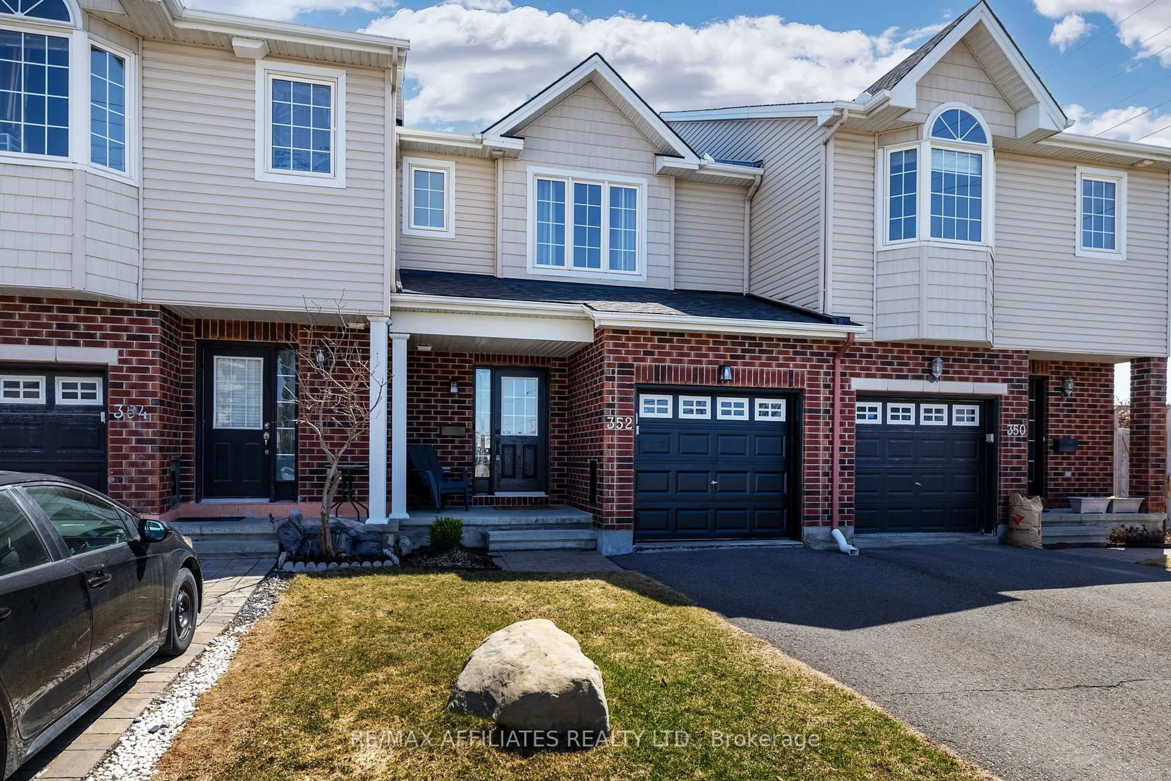Home with brick exterior material, street for 352 Copperfield Cres, Ottawa Ontario K2J 0L2