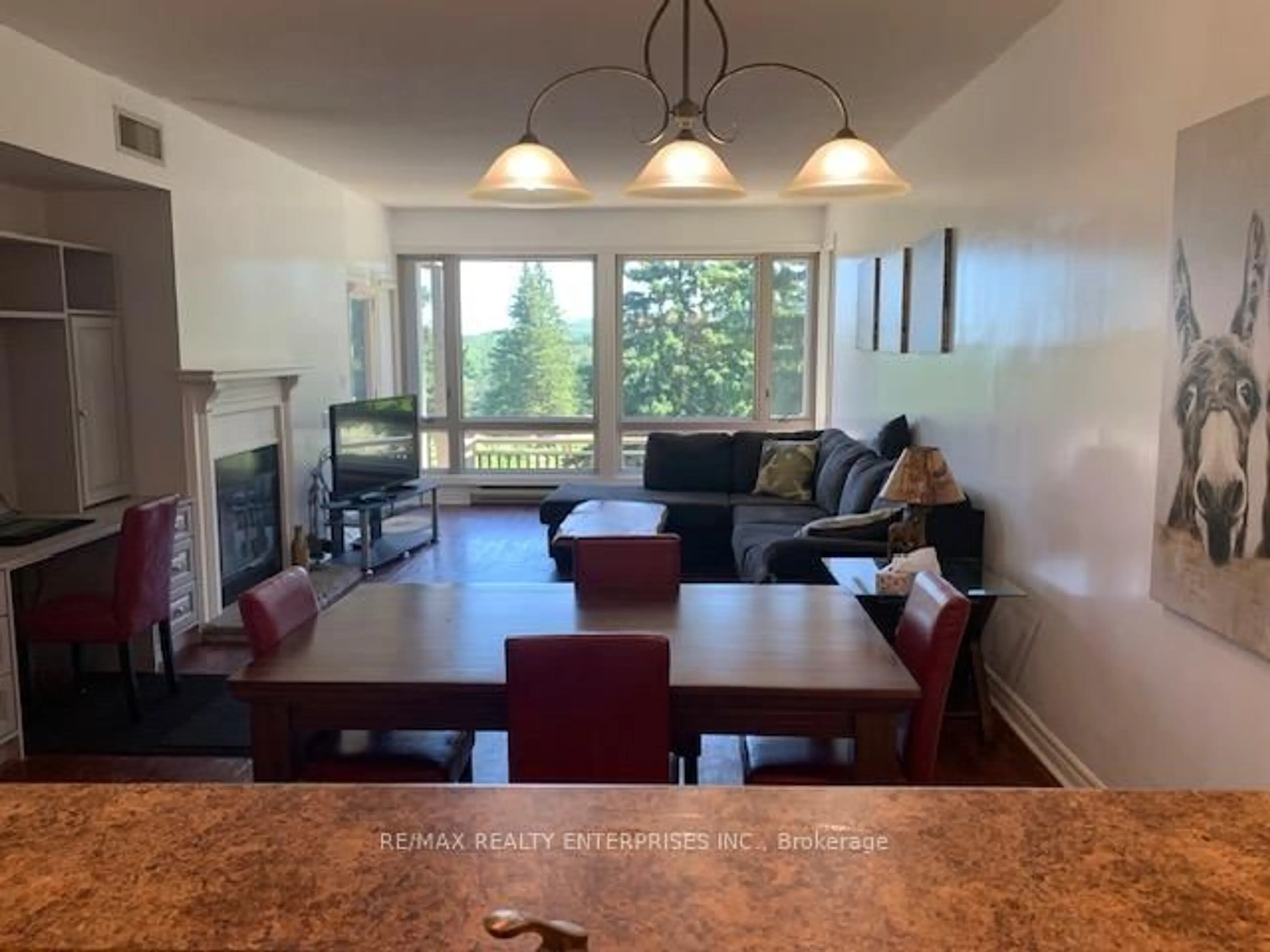 Living room with furniture, wood/laminate floor for 3111 Grandview Forest Hill Dr #2, Huntsville Ontario P1H 2J5