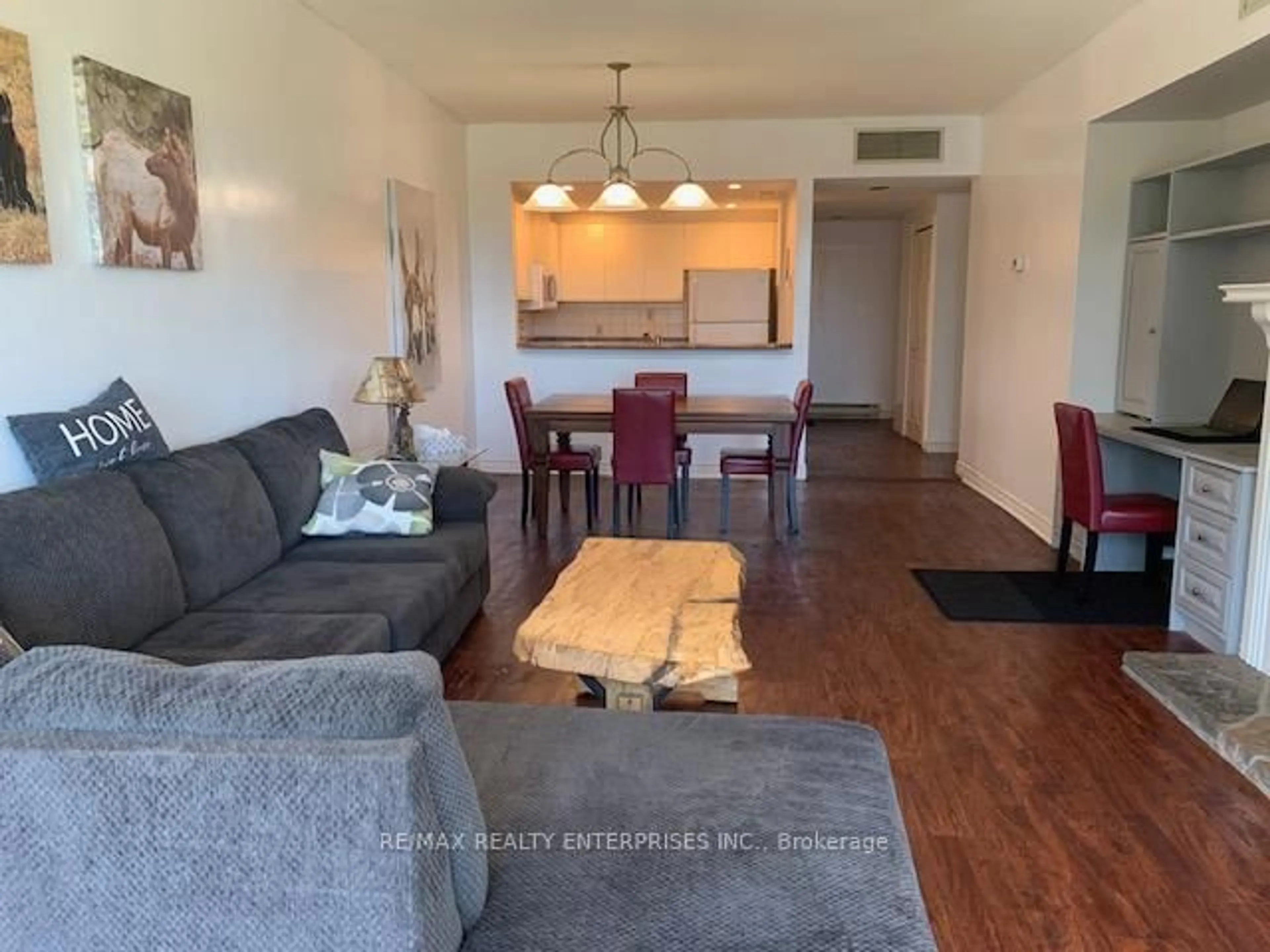 Living room with furniture, wood/laminate floor for 3111 Grandview Forest Hill Dr #2, Huntsville Ontario P1H 2J5