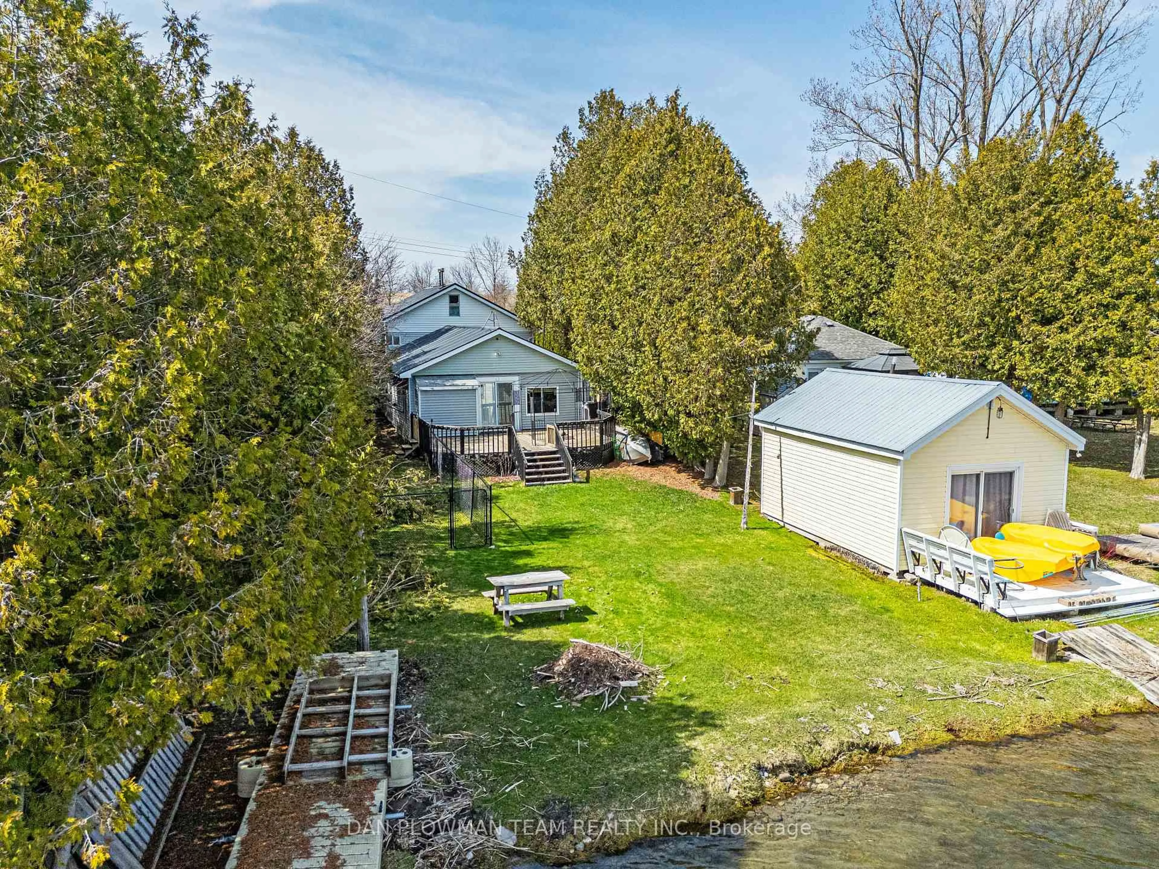 A pic from outside/outdoor area/front of a property/back of a property/a pic from drone, water/lake/river/ocean view for 32 Beach Rd, Kawartha Lakes Ontario K0M 2C0