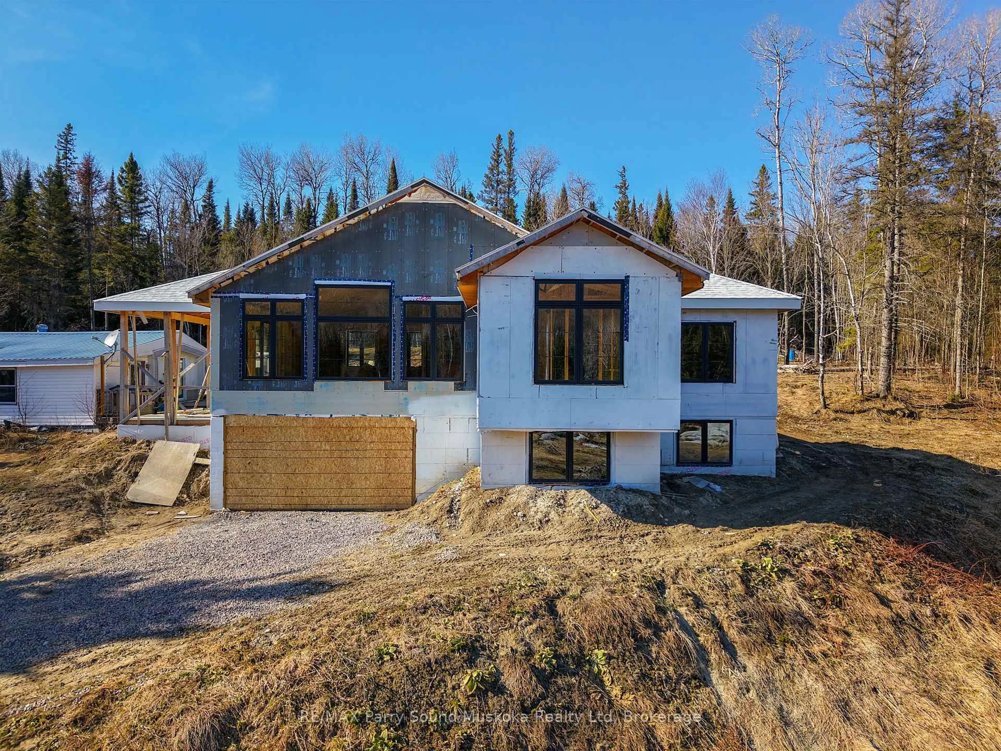 A pic from outside/outdoor area/front of a property/back of a property/a pic from drone, building for 556 Highway 518 N/A, Perry Ontario P0A 1J0