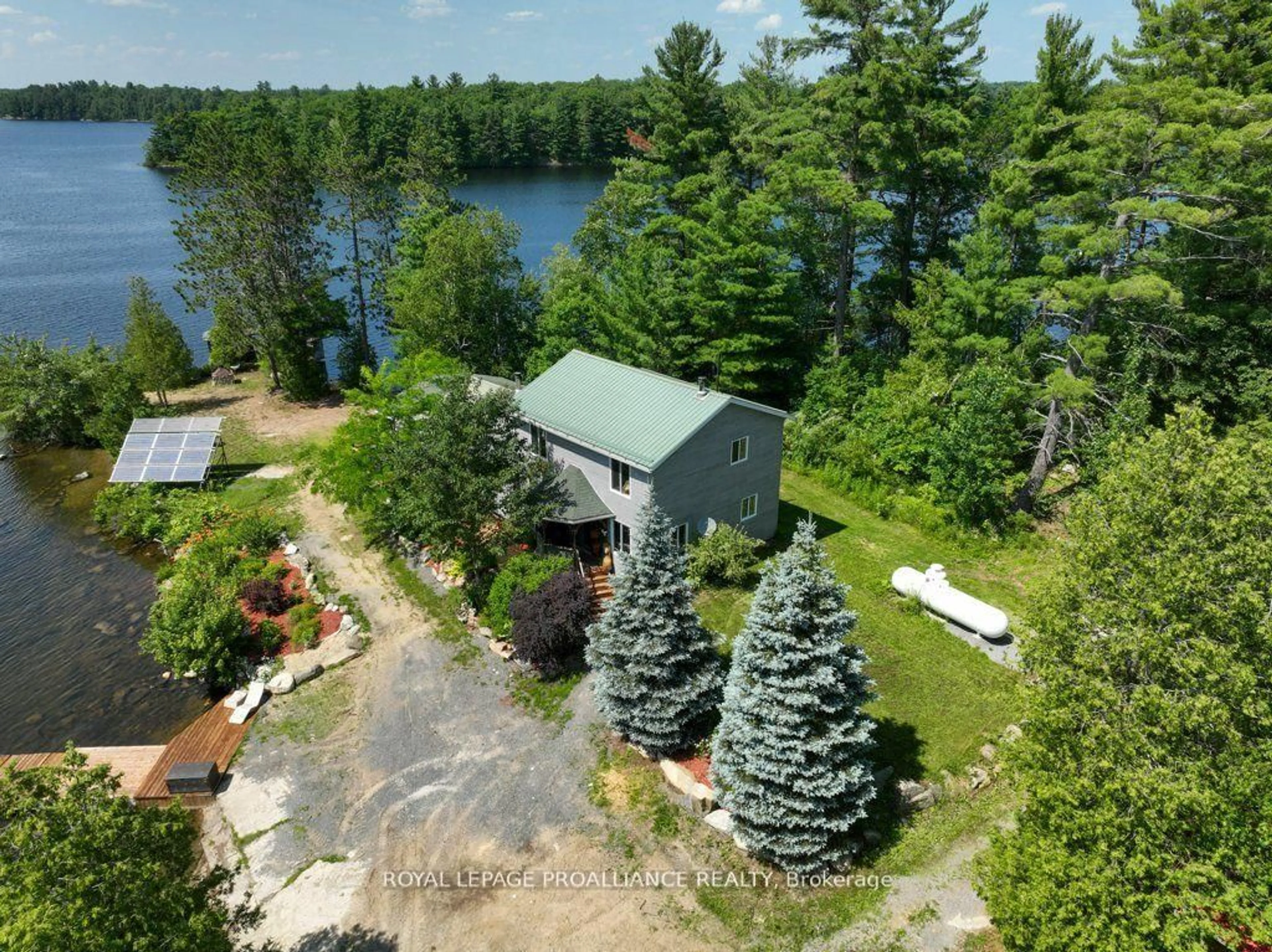 A pic from outside/outdoor area/front of a property/back of a property/a pic from drone, water/lake/river/ocean view for 2475 Alf's Bay Lane, Arden Ontario K0H 1B0