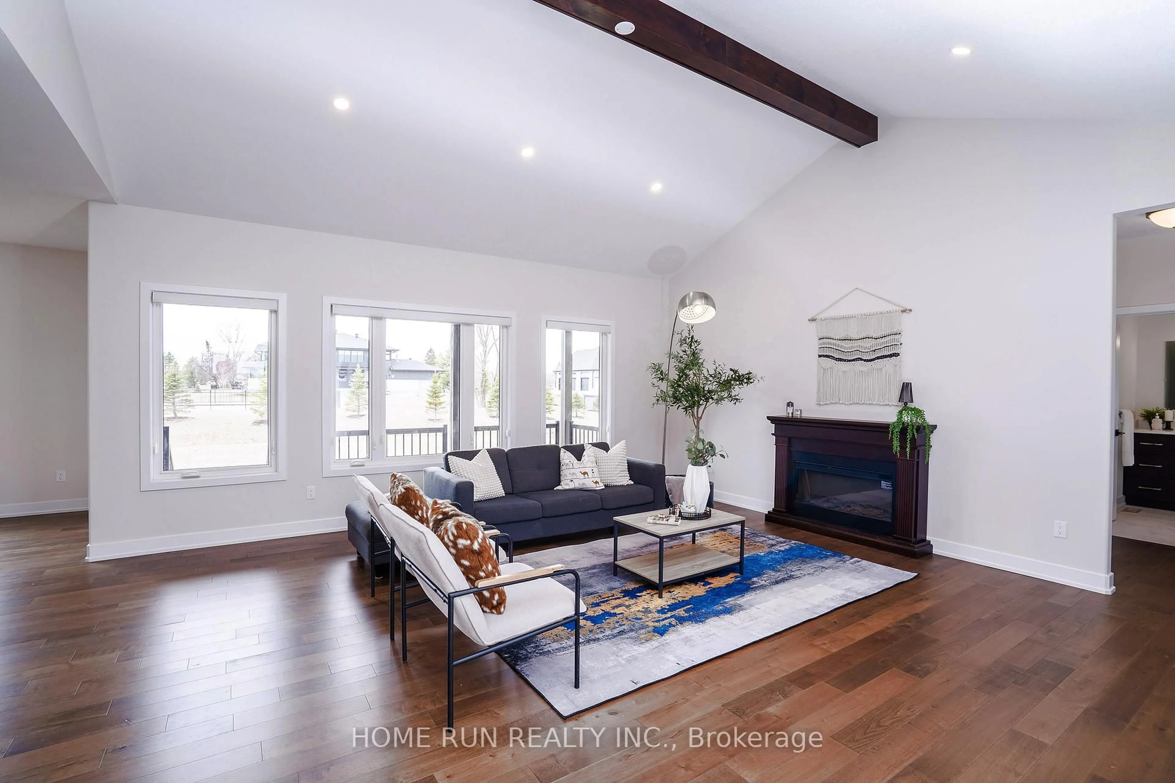 Living room with furniture, wood/laminate floor for 212 SUMMERVIEW Terr, Ottawa Ontario K4P 1R3