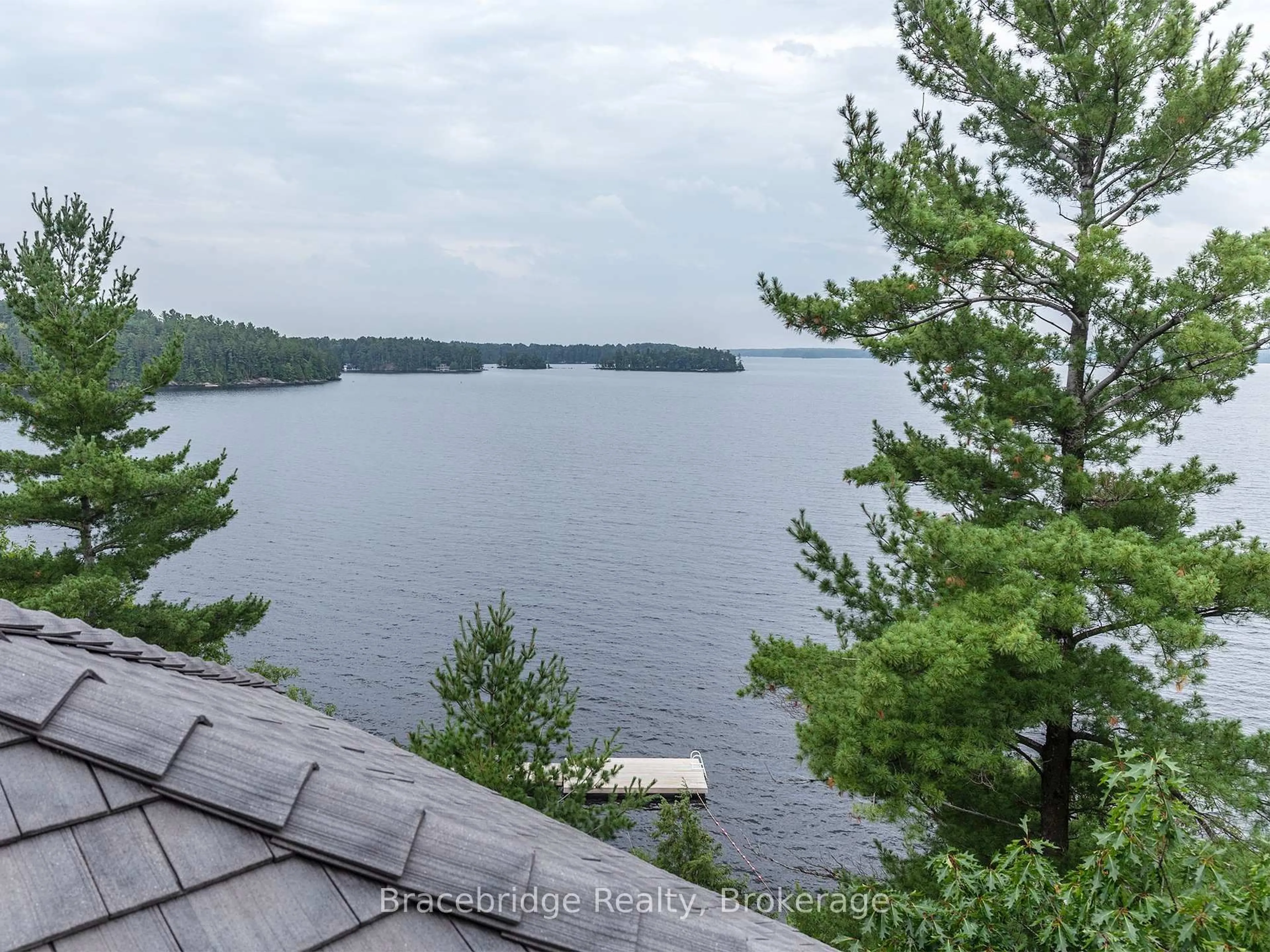 A pic from outside/outdoor area/front of a property/back of a property/a pic from drone, water/lake/river/ocean view for 1869 Muskoka Rd 118 Highway #A202-D1, Muskoka Lakes Ontario P1L 1W8