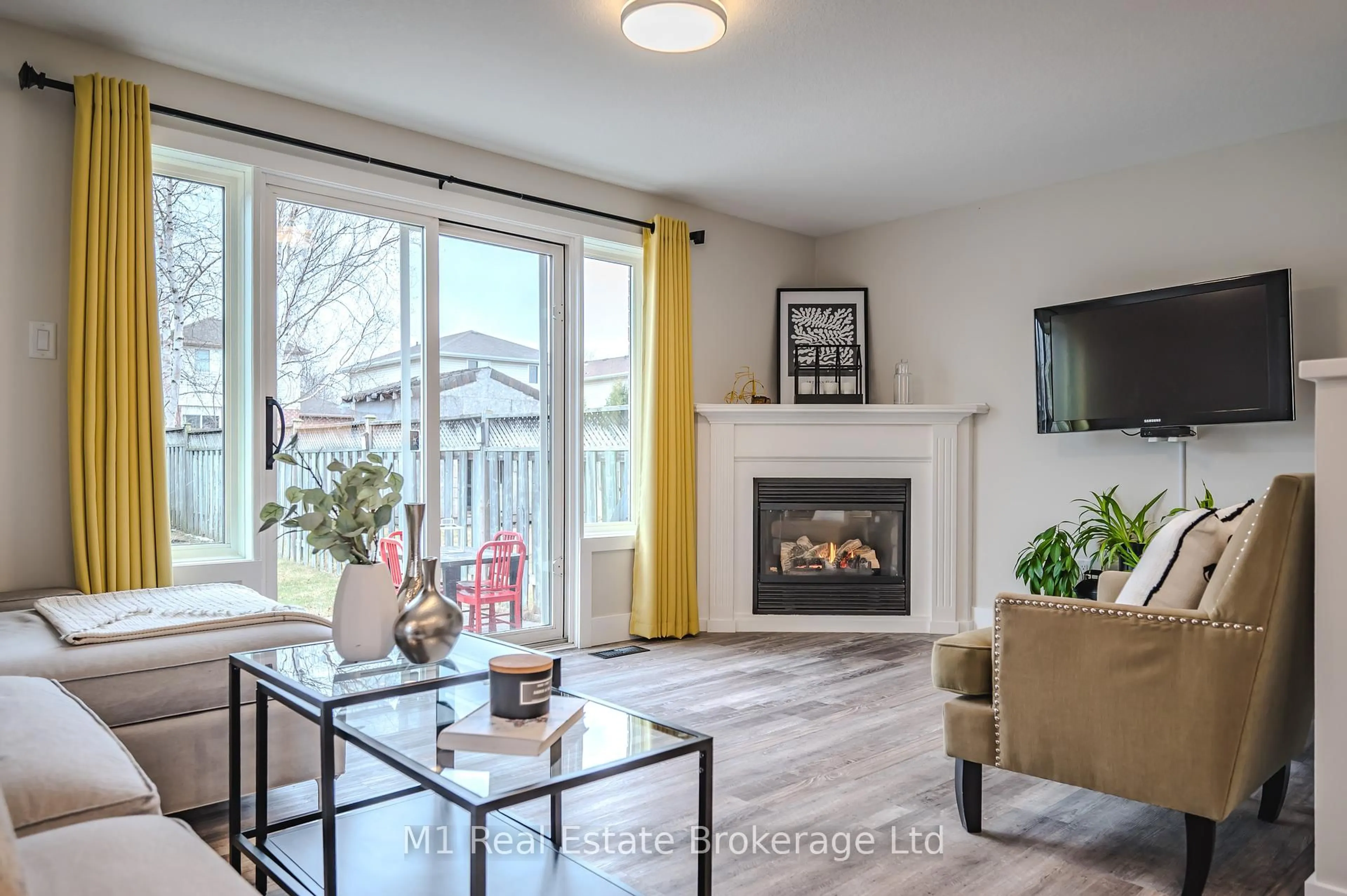 Living room with furniture, wood/laminate floor for 155 Stephanie Dr, Guelph Ontario N1K 1X7