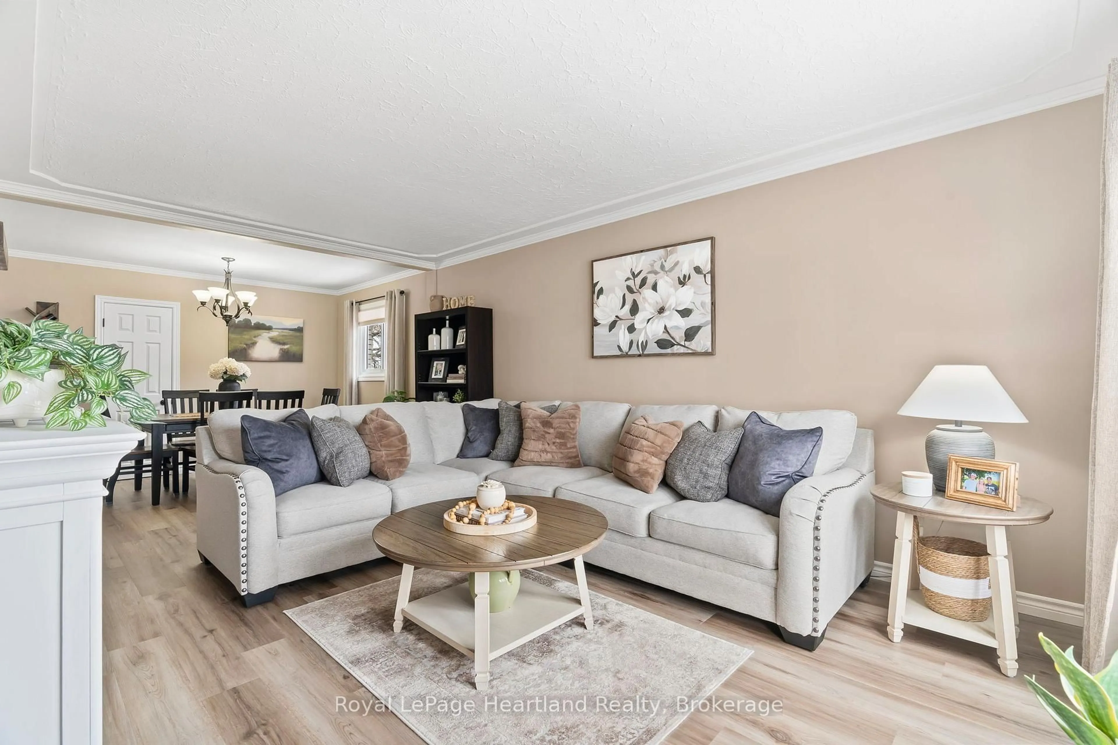Living room with furniture, wood/laminate floor for 465 Main St, Minto Ontario N0G 2P0