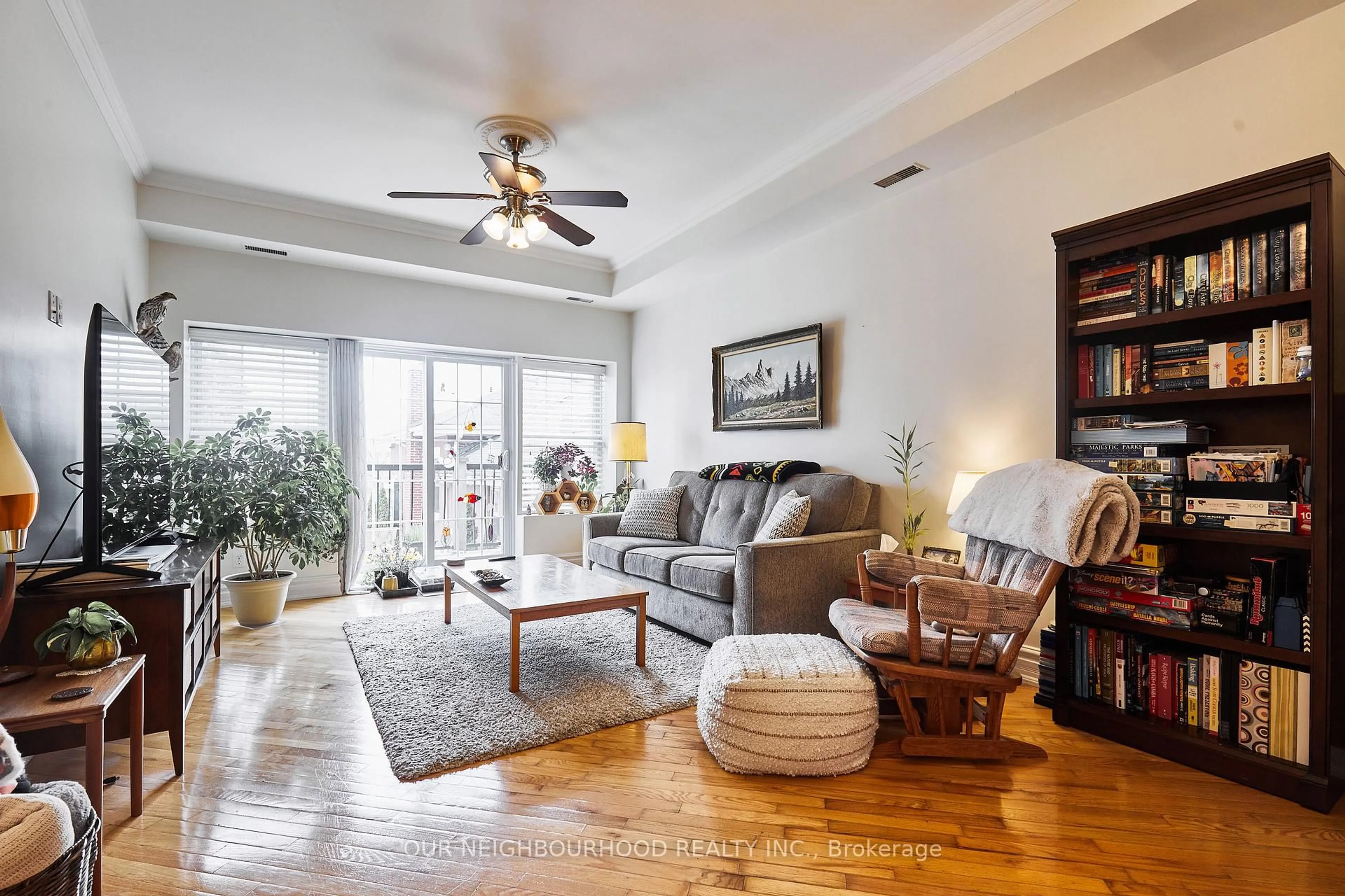 Living room with furniture, wood/laminate floor for 79 King St #202, Cobourg Ontario K9A 2M4
