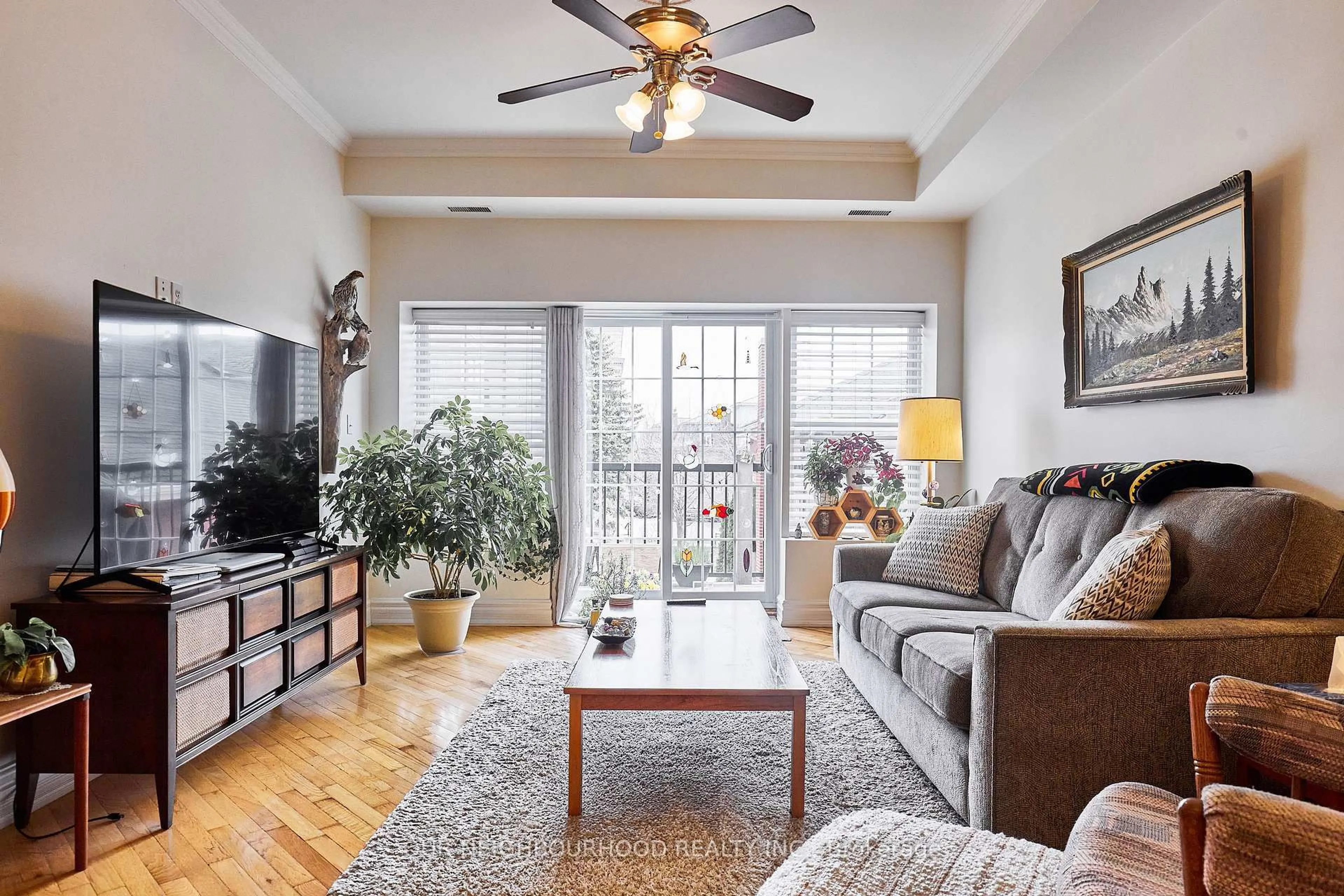 Living room with furniture, wood/laminate floor for 79 King St #202, Cobourg Ontario K9A 2M4