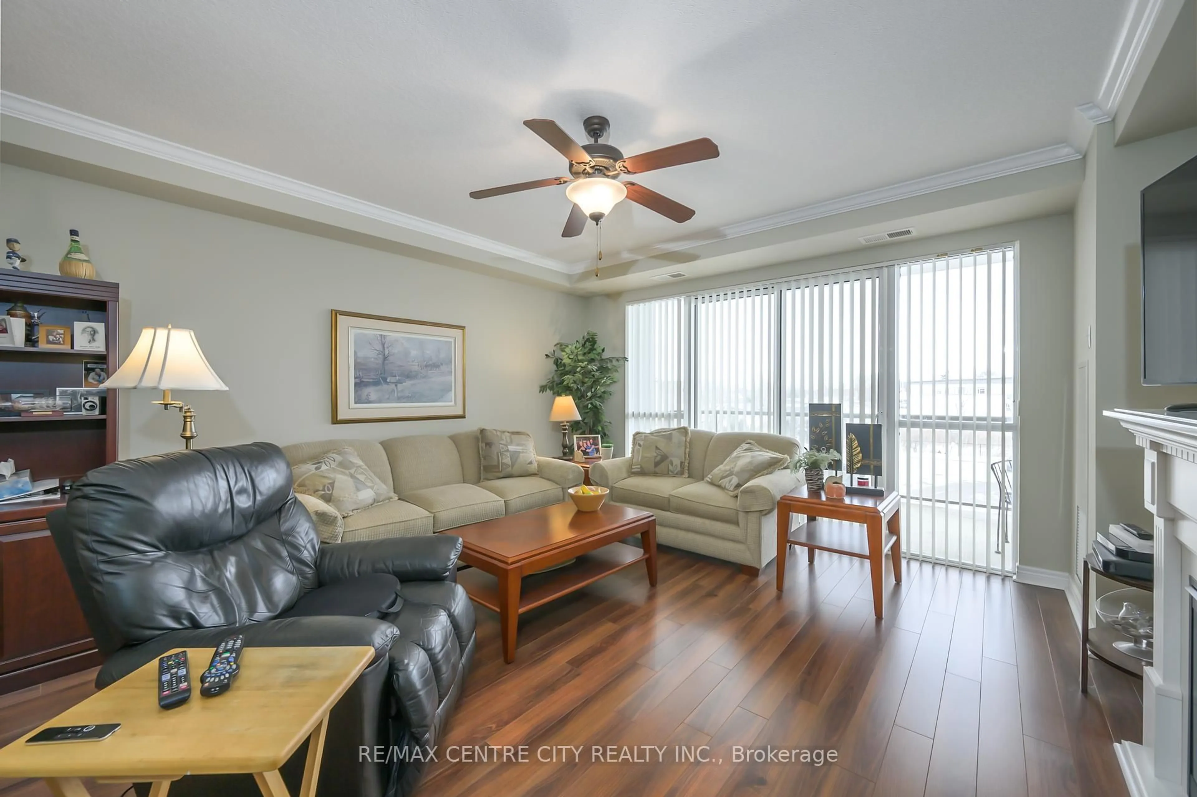 Living room with furniture, wood/laminate floor for 1030 CORONATION Dr #306, London North Ontario N6G 0G5