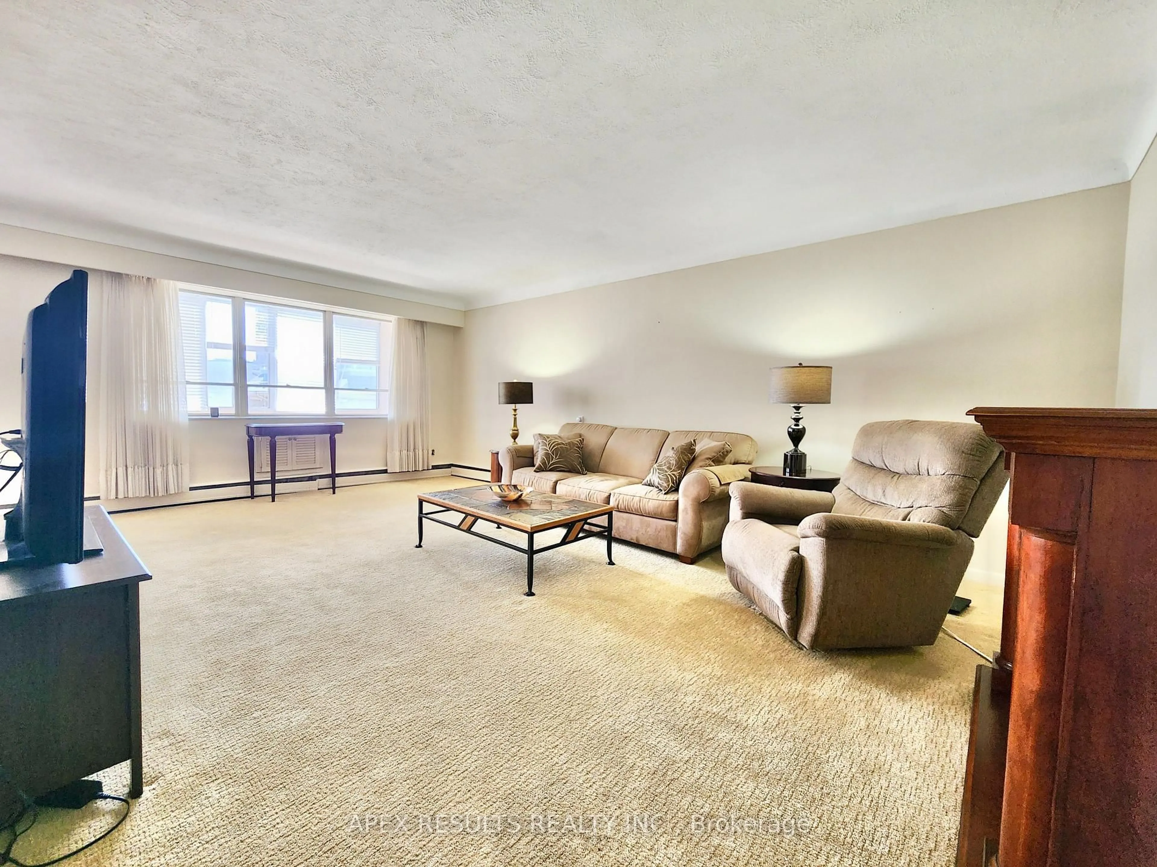 Living room with furniture, carpet floor for 38 Charlton Ave #204, Hamilton Ontario L8P 2C1