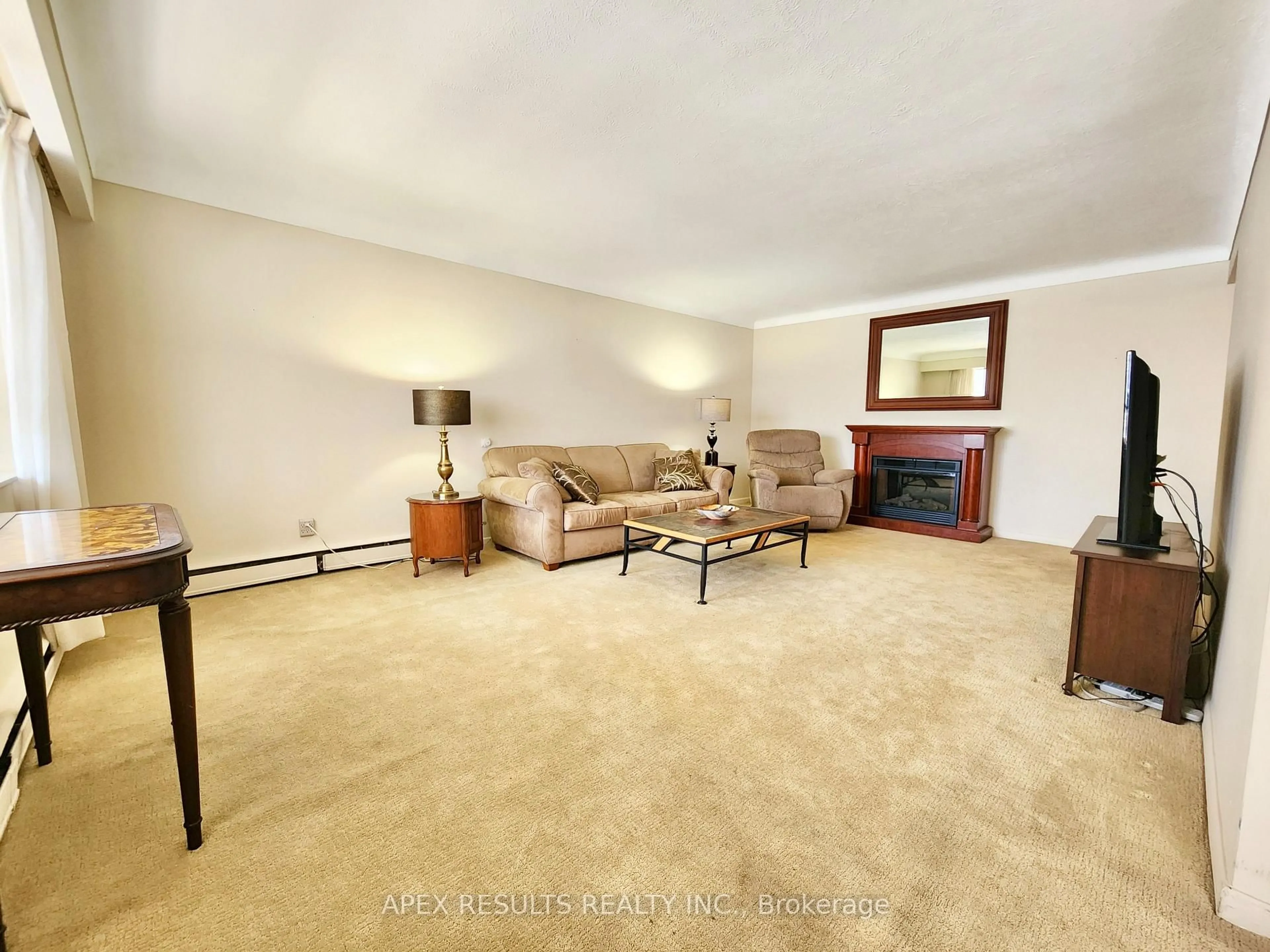 Living room with furniture, carpet floor for 38 Charlton Ave #204, Hamilton Ontario L8P 2C1