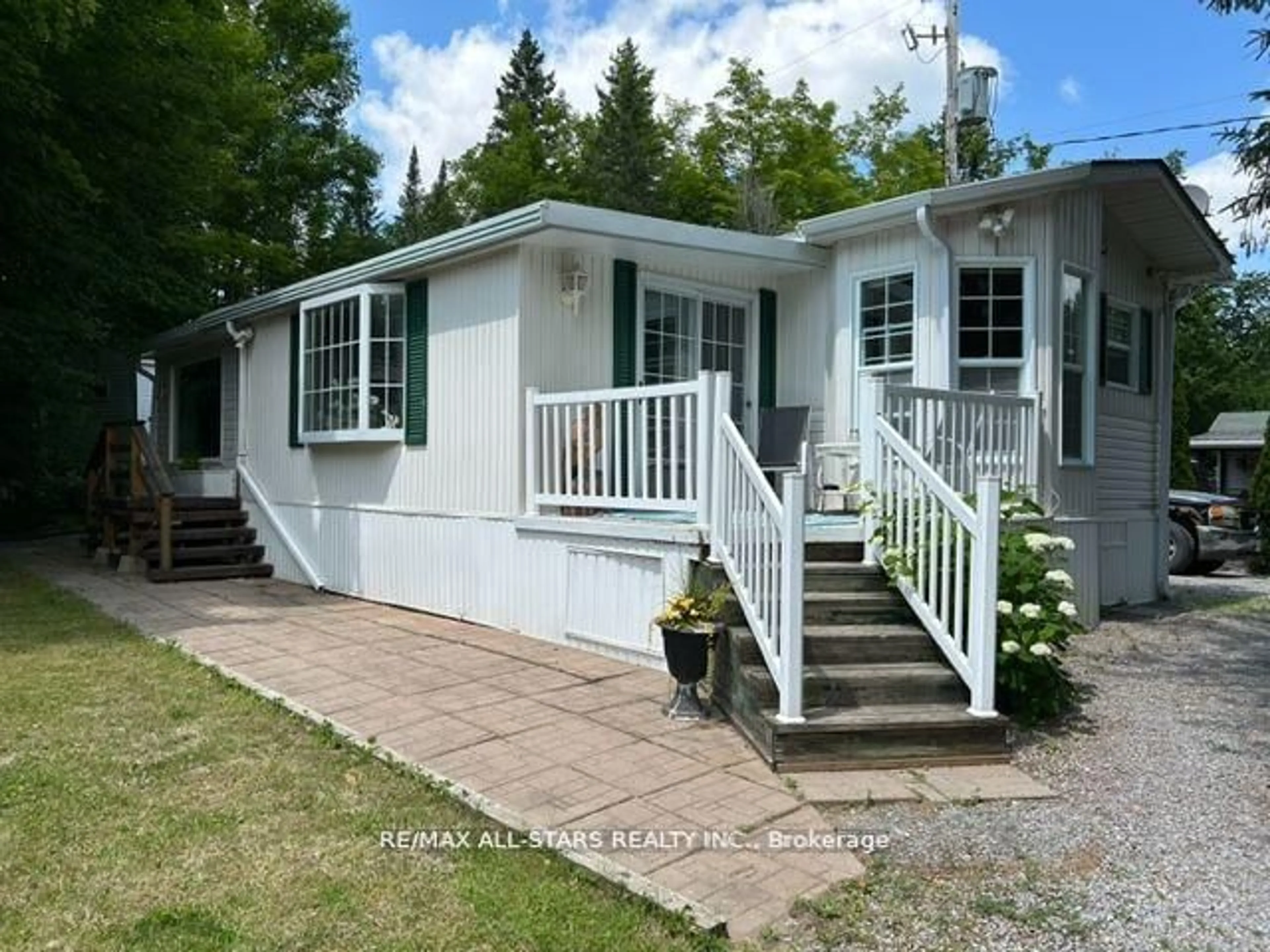 Home with vinyl exterior material, street for 1802 County Rd 121 N/A #LOT 312, Kawartha Lakes Ontario K0M 1N0