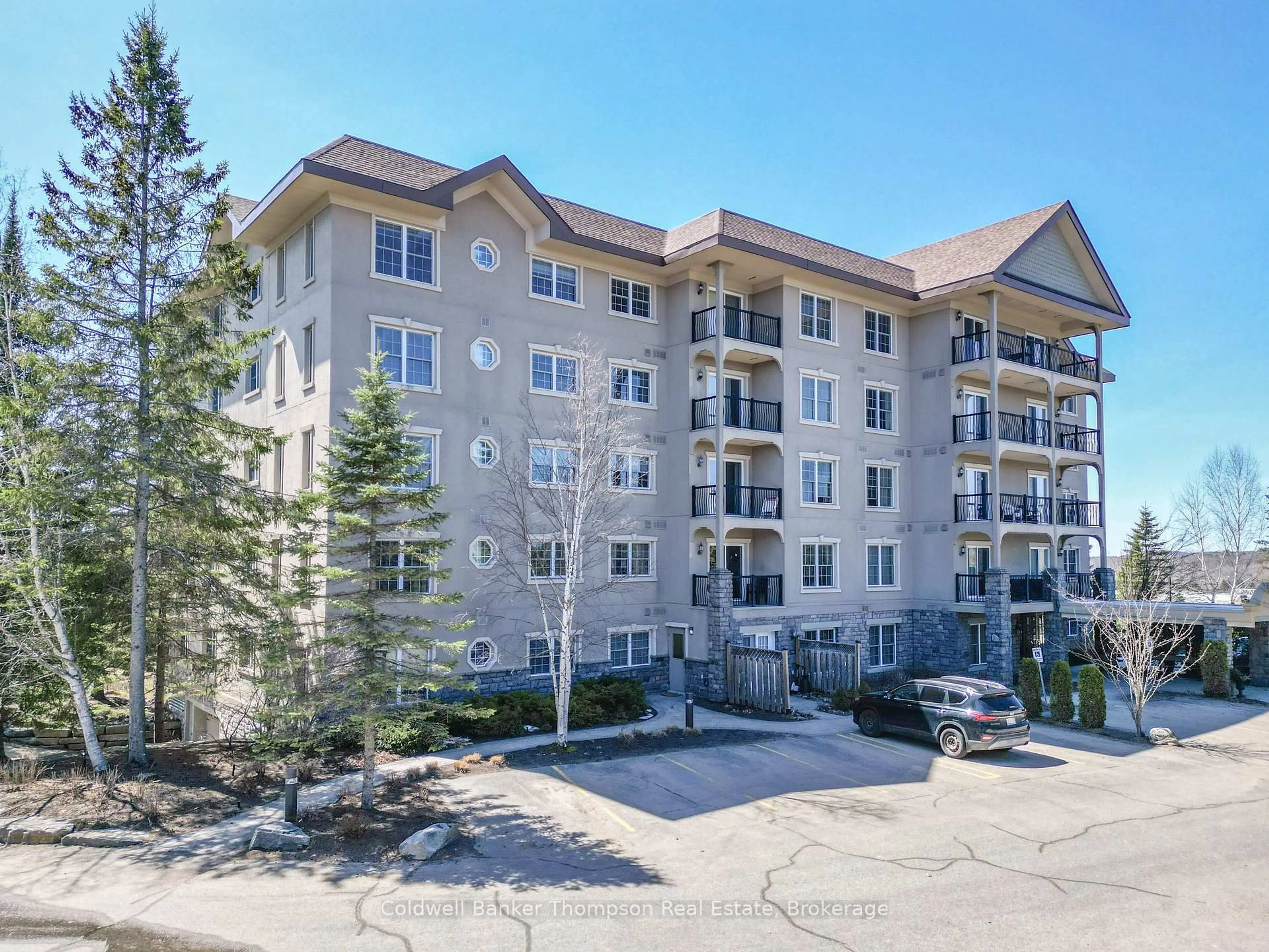 A pic from outside/outdoor area/front of a property/back of a property/a pic from drone, unknown for 4 Legacy Lane #208, Huntsville Ontario P1H 2R2