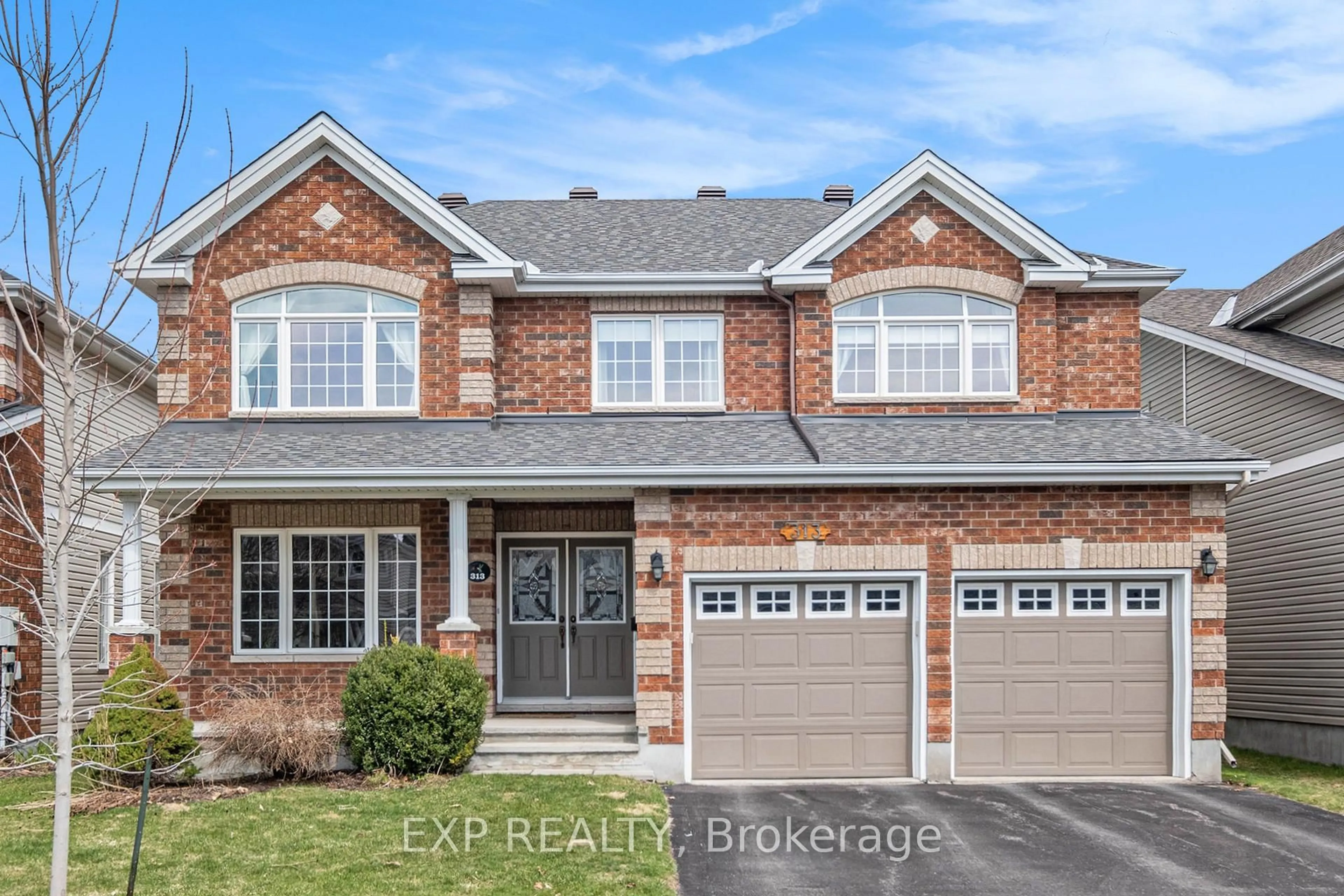 Home with brick exterior material, street for 313 Wild Iris Ave, Ottawa Ontario K1T 0B6