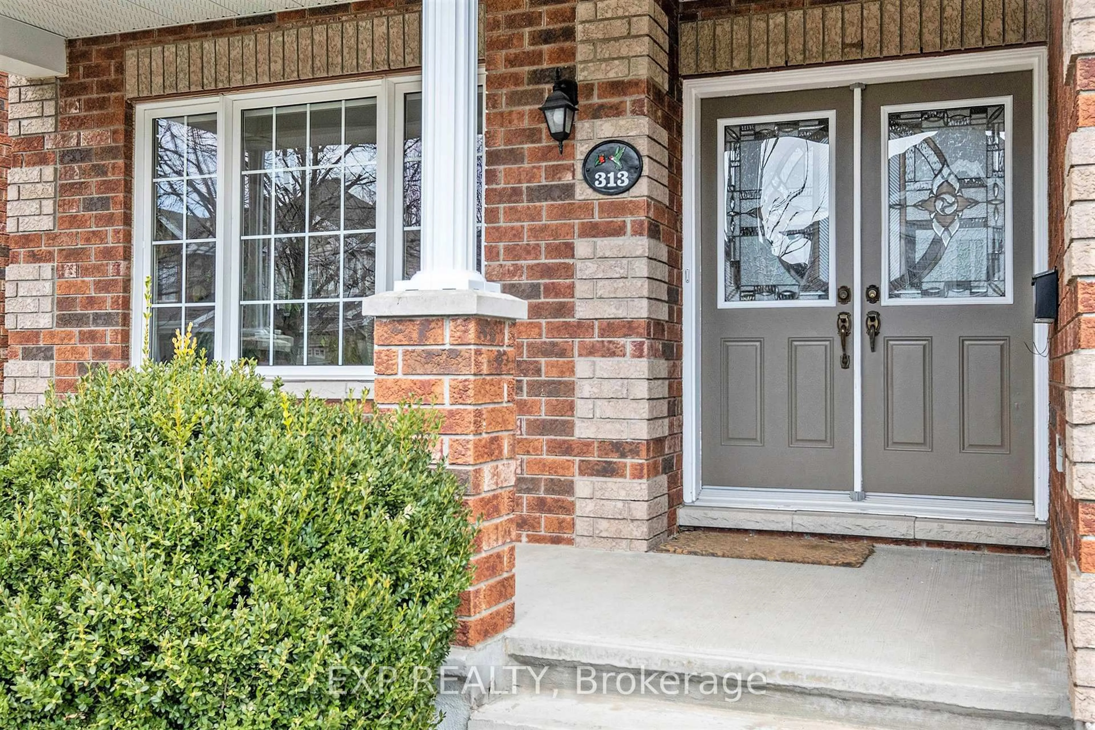 Home with brick exterior material, street for 313 Wild Iris Ave, Ottawa Ontario K1T 0B6