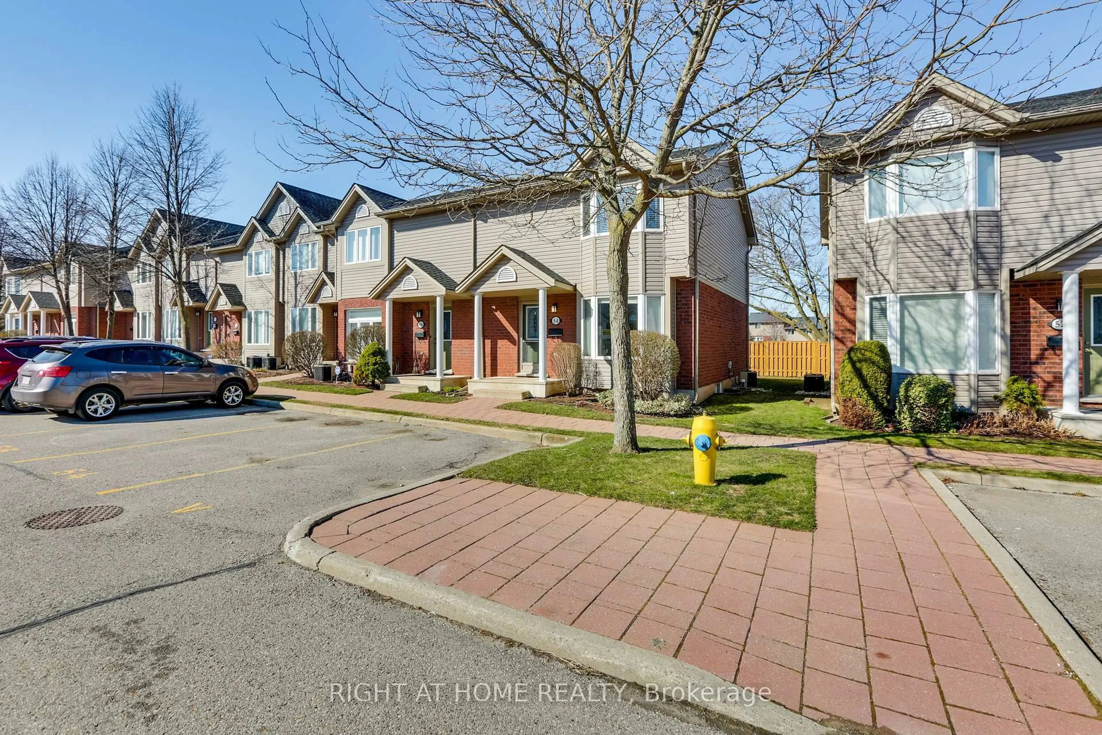 A pic from outside/outdoor area/front of a property/back of a property/a pic from drone, street for 1535 Trossacks Ave #54, London North Ontario N5X 4R1
