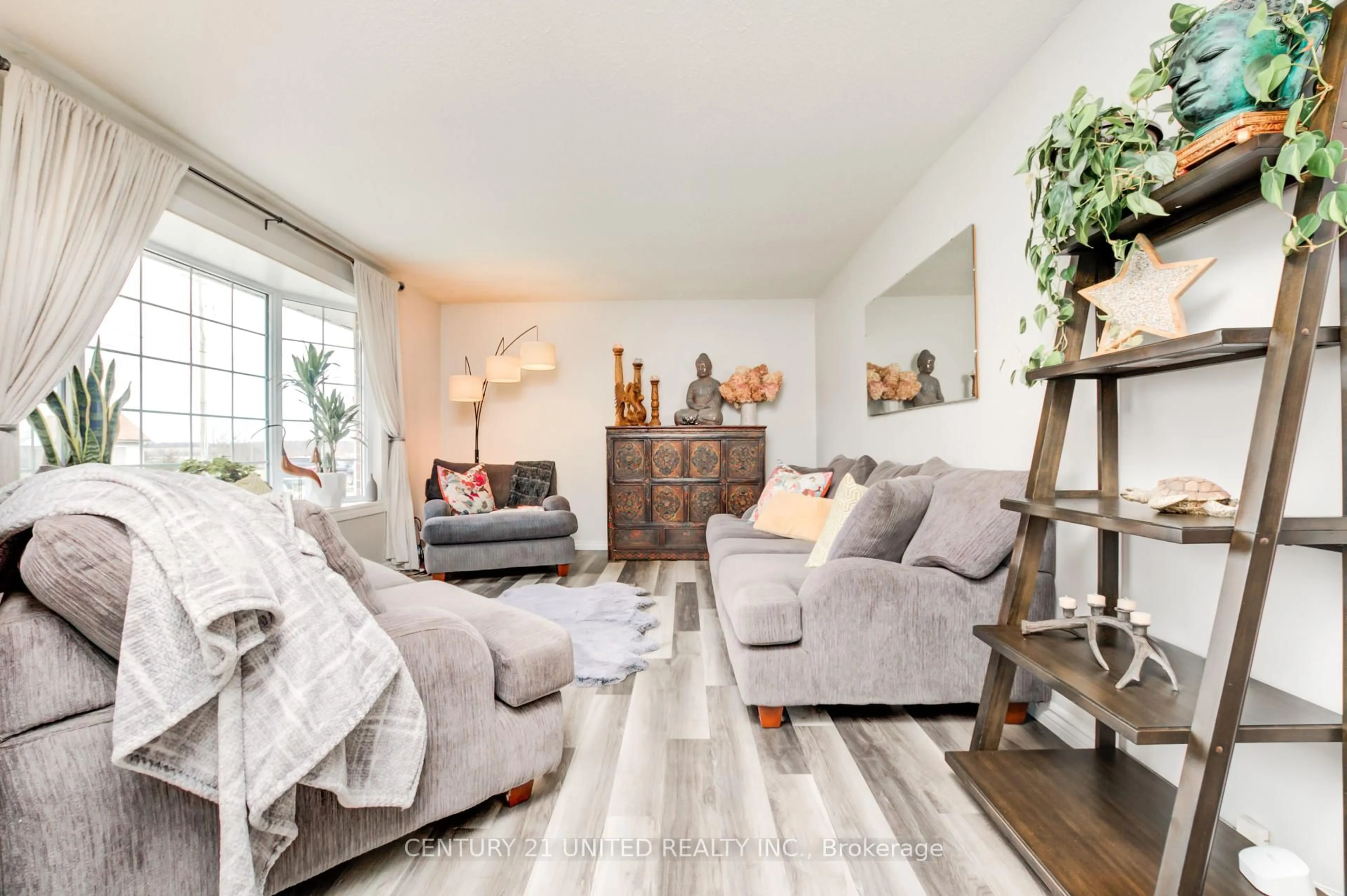 Living room with furniture, wood/laminate floor for 233 Market St, Trent Hills Ontario K0L 1L0
