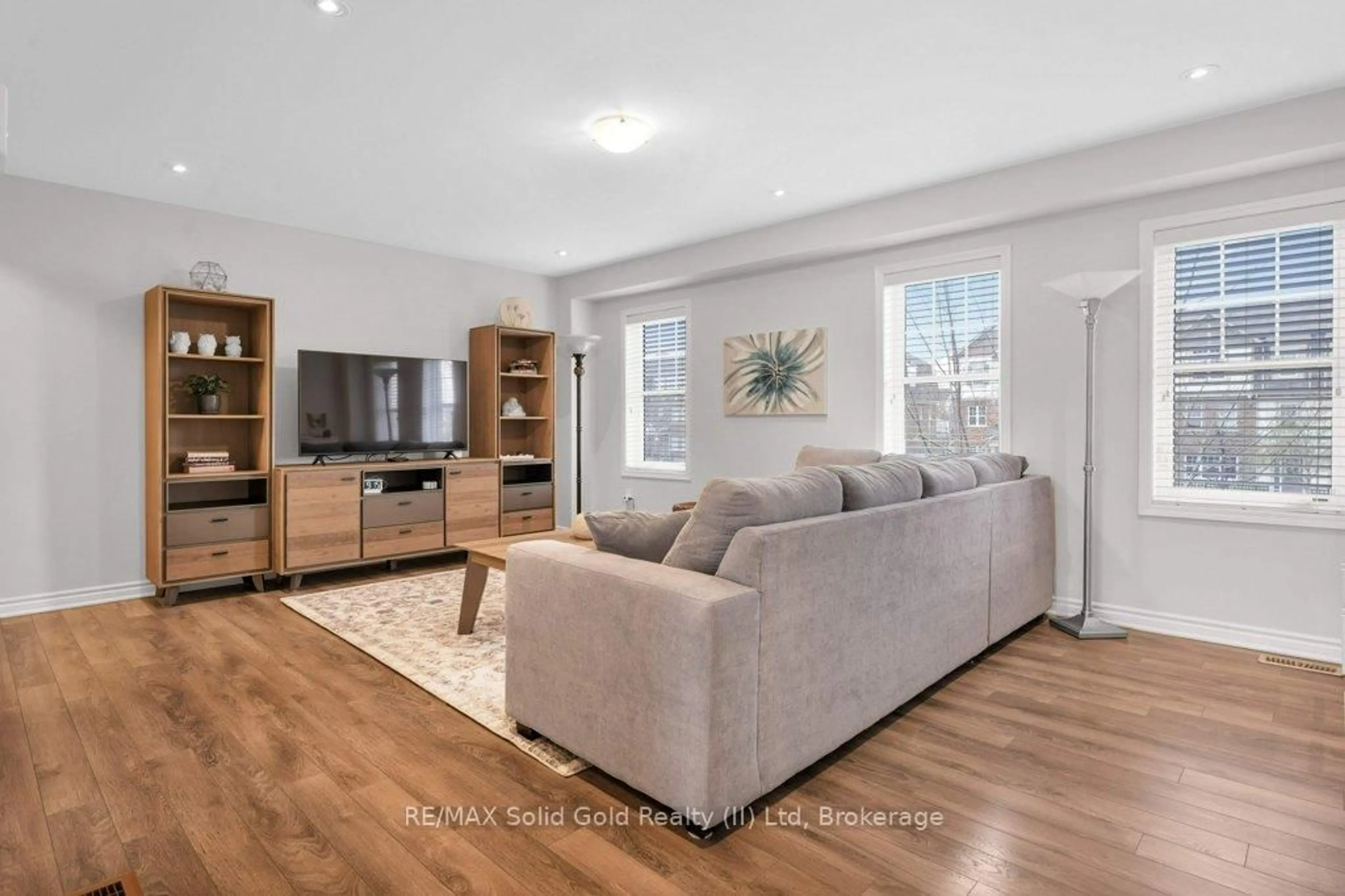 Living room with furniture, wood/laminate floor for 133 Ludolph St, Kitchener Ontario N2R 0L9