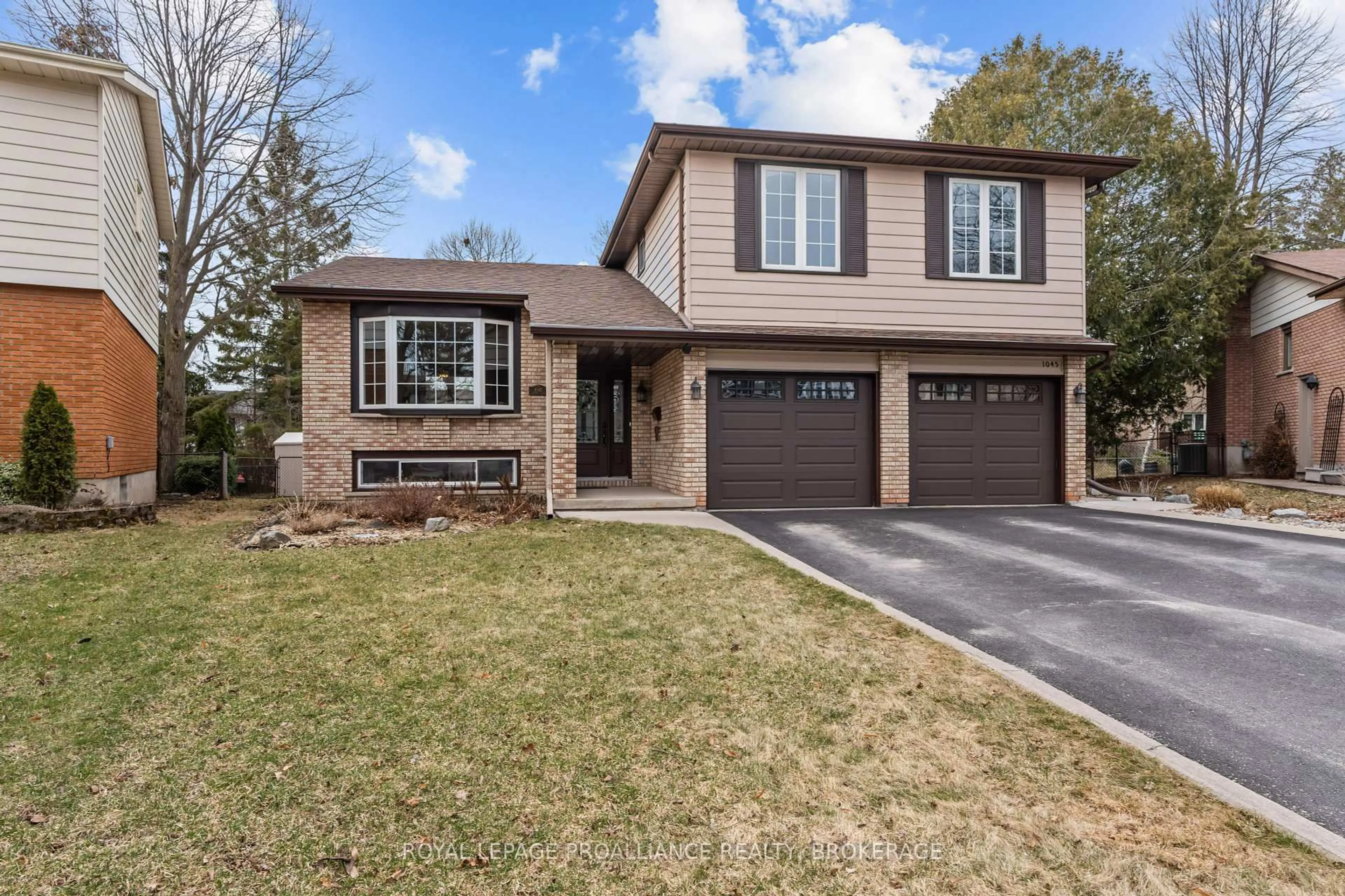 Home with brick exterior material, street for 1045 Lawton Pl, Kingston Ontario K7P 1M2