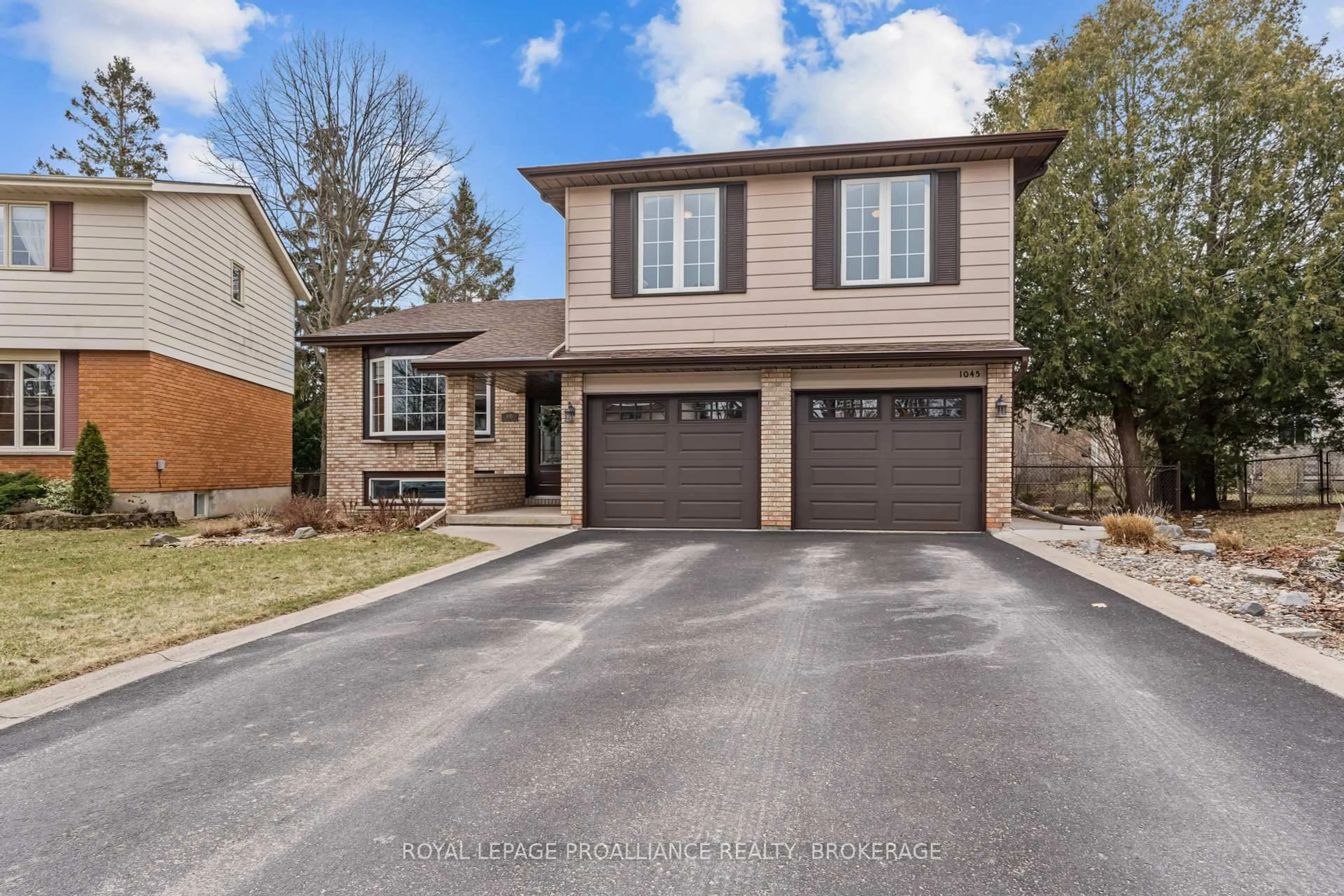 Home with brick exterior material, street for 1045 Lawton Pl, Kingston Ontario K7P 1M2