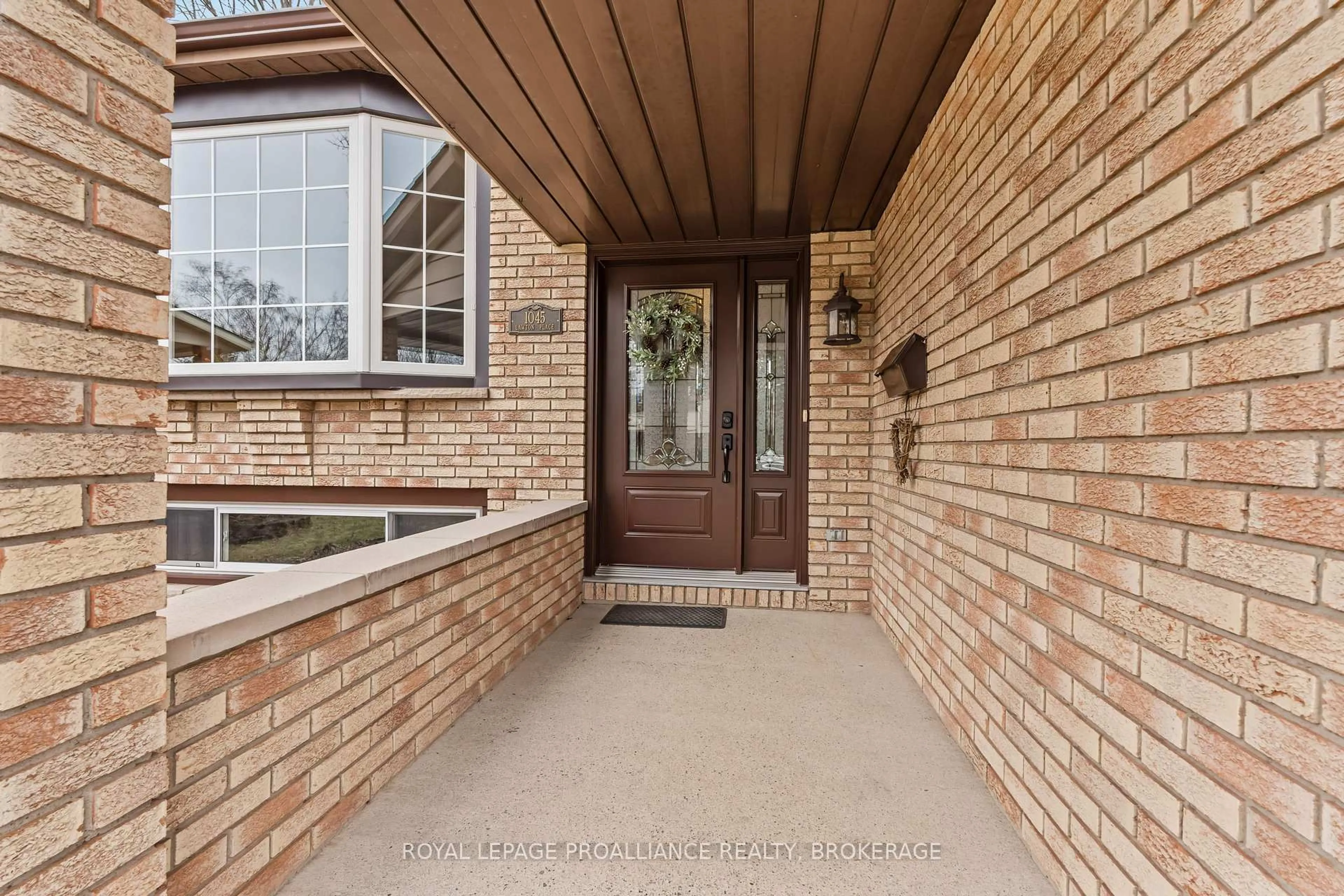 Home with brick exterior material, street for 1045 Lawton Pl, Kingston Ontario K7P 1M2