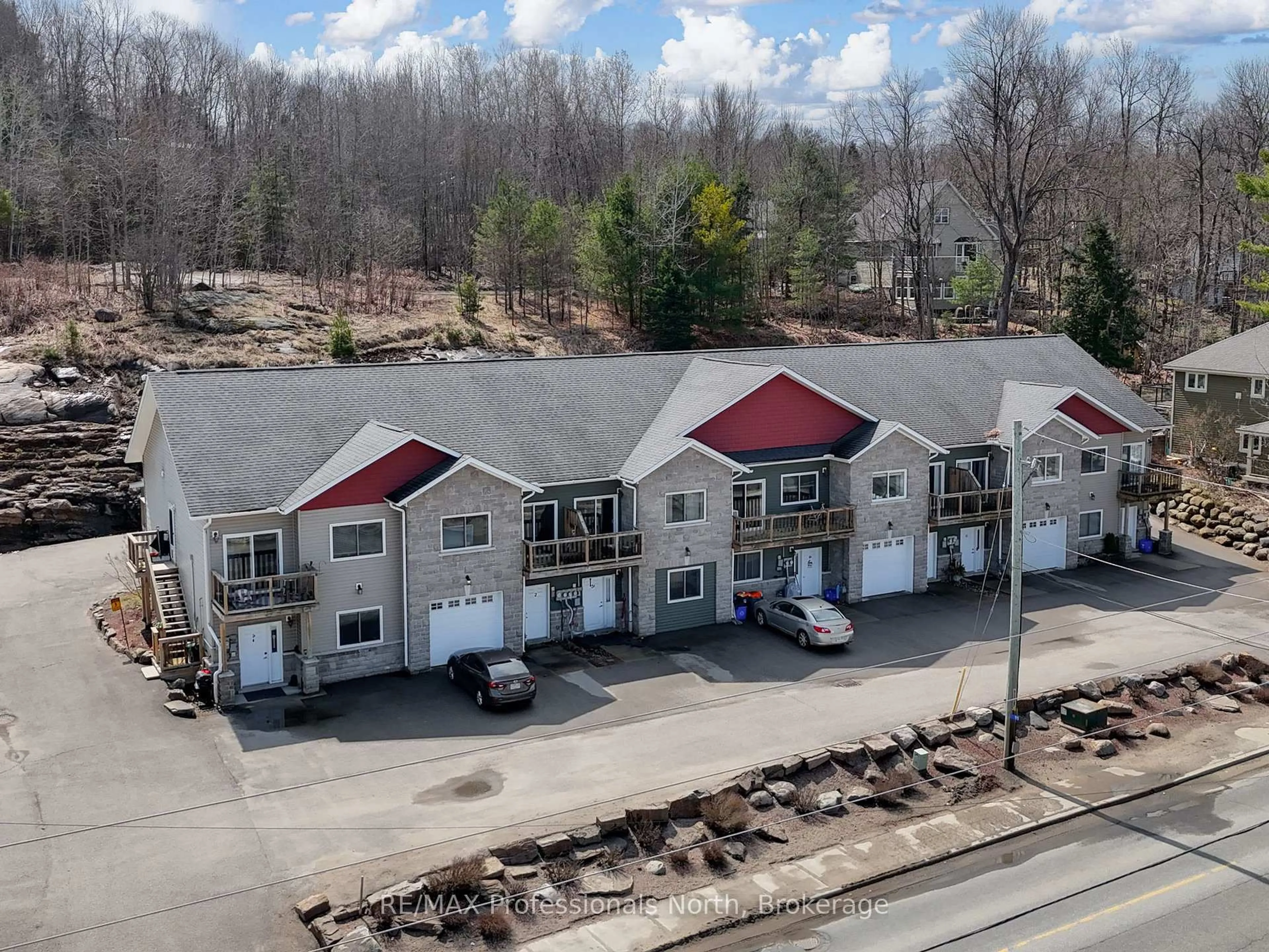 A pic from outside/outdoor area/front of a property/back of a property/a pic from drone, unknown for 99 Main St #3A & 3B, Huntsville Ontario P1H 2A8