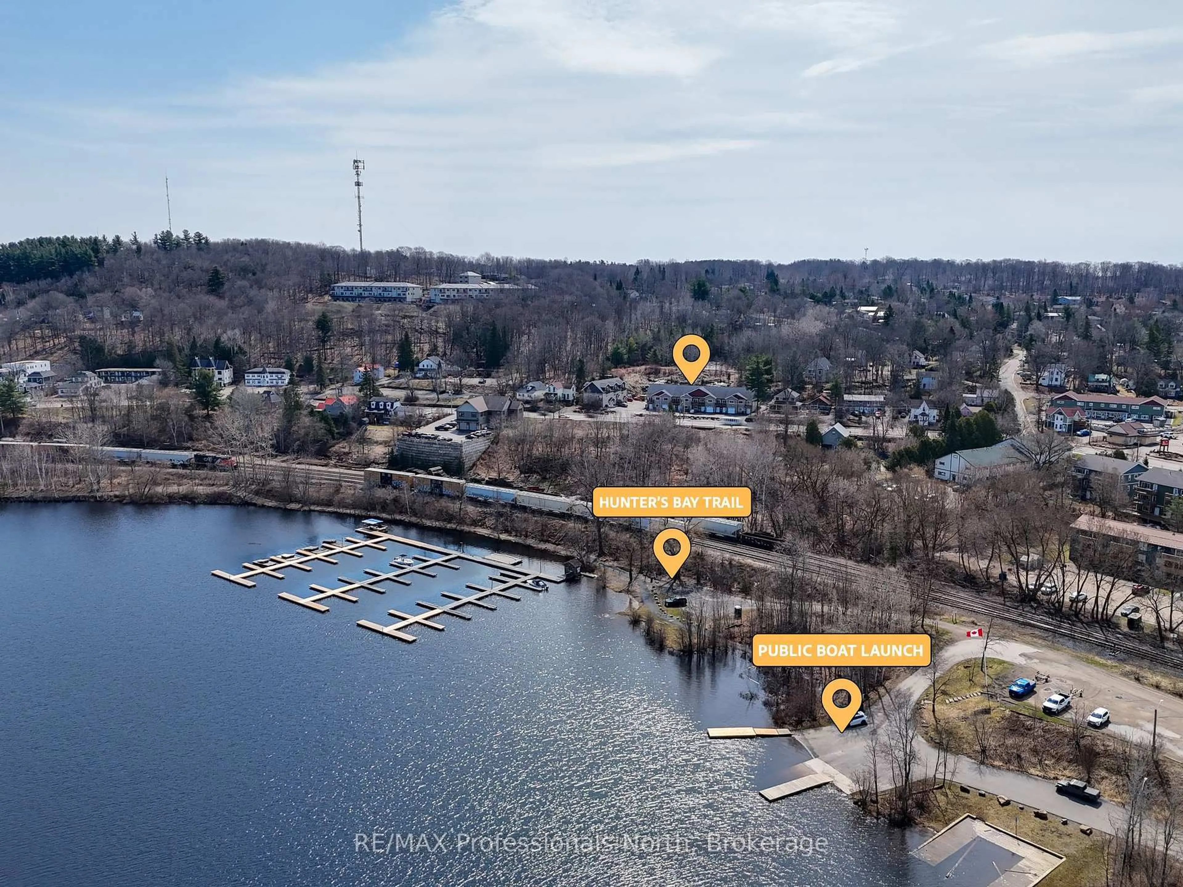 A pic from outside/outdoor area/front of a property/back of a property/a pic from drone, water/lake/river/ocean view for 99 Main St #3A & 3B, Huntsville Ontario P1H 2A8