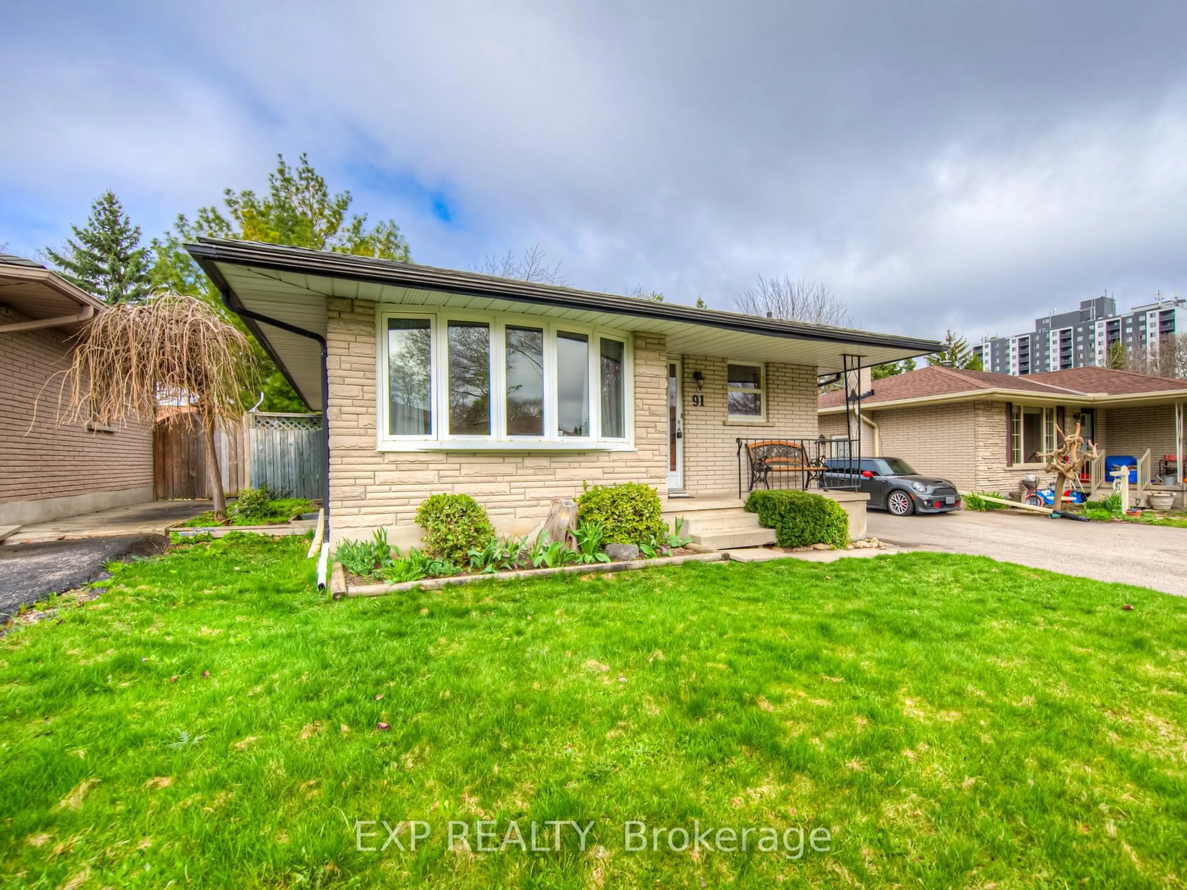 Home with brick exterior material, street for 91 Kimberly Cres, Kitchener Ontario N2E 1C8