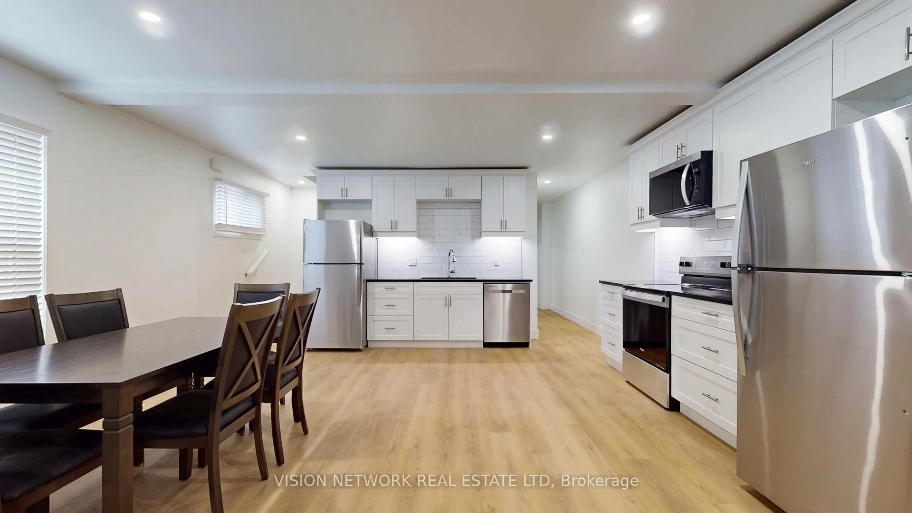 Open concept kitchen, wood/laminate floor for 58 Wilson Ave, London North Ontario N6H 1H4