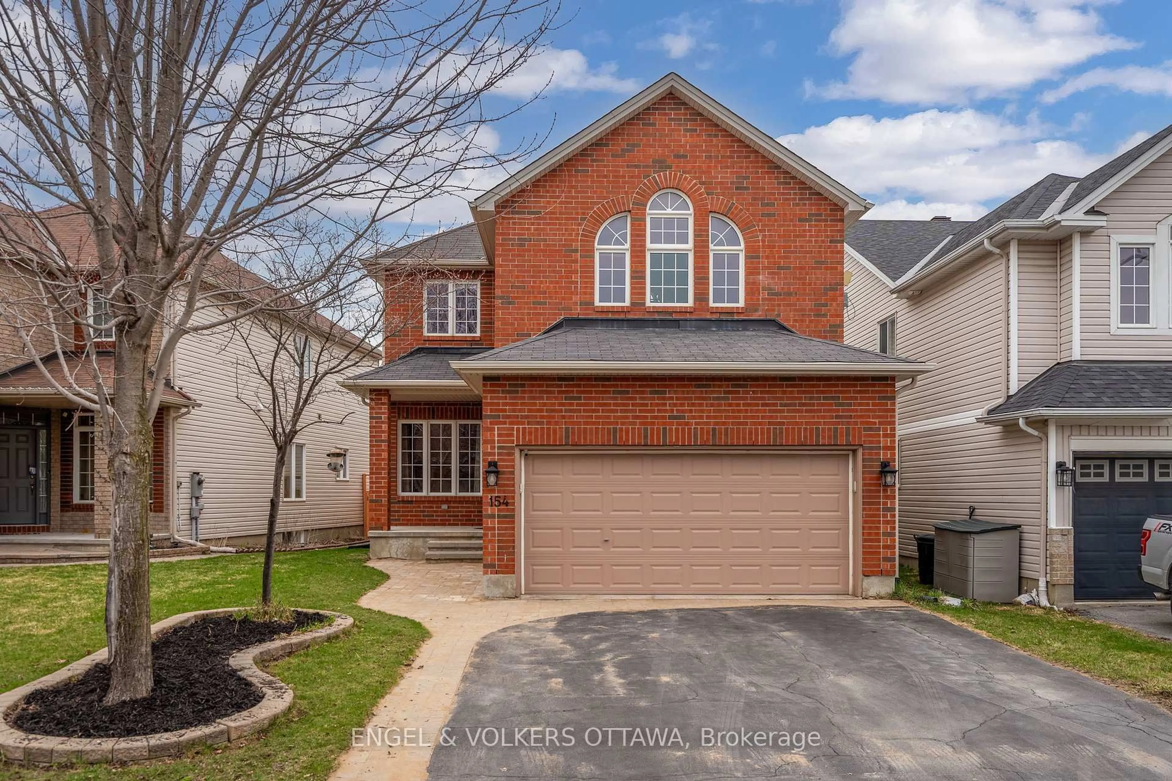 Home with brick exterior material, street for 154 Macara Cres, Ottawa Ontario K2K 0E1