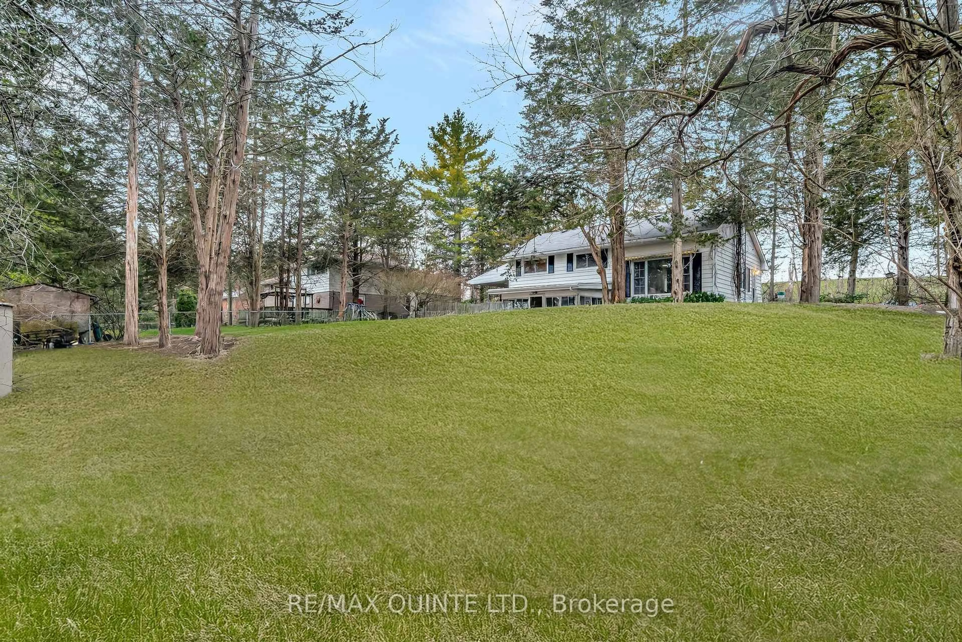A pic from outside/outdoor area/front of a property/back of a property/a pic from drone, water/lake/river/ocean view for 157 Lock Rd, Quinte West Ontario K8V 5P6