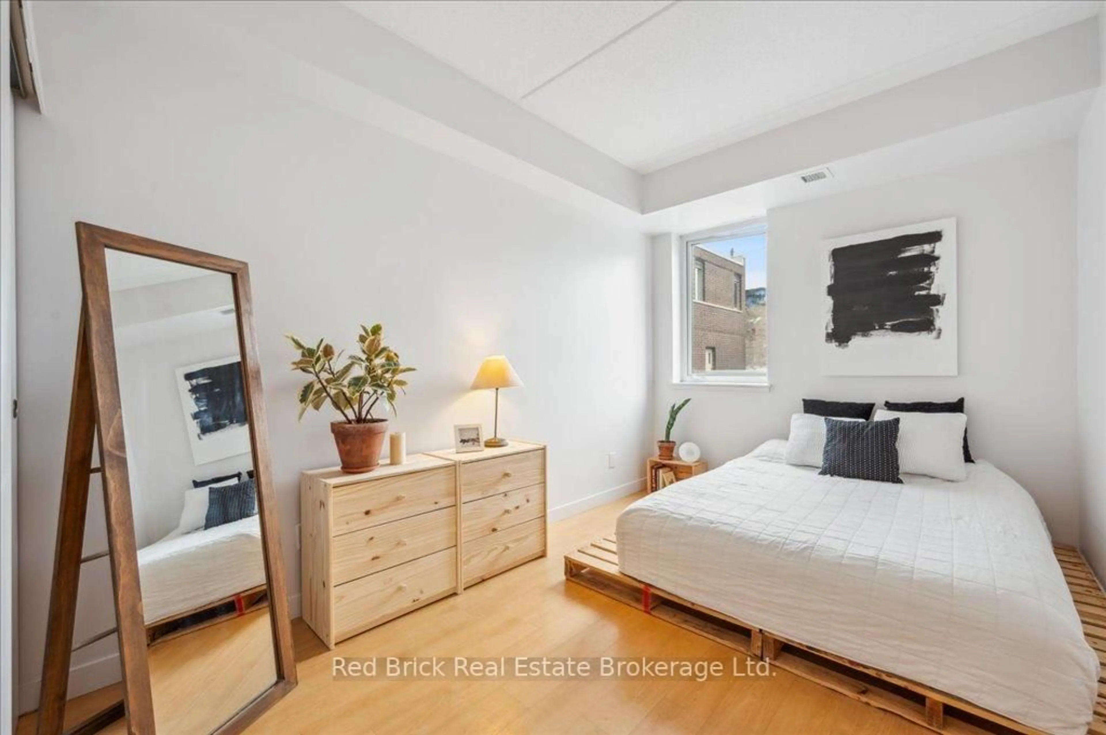Bedroom with bed, wood/laminate floor for 5 Gordon St #307, Guelph Ontario N1H 4G8