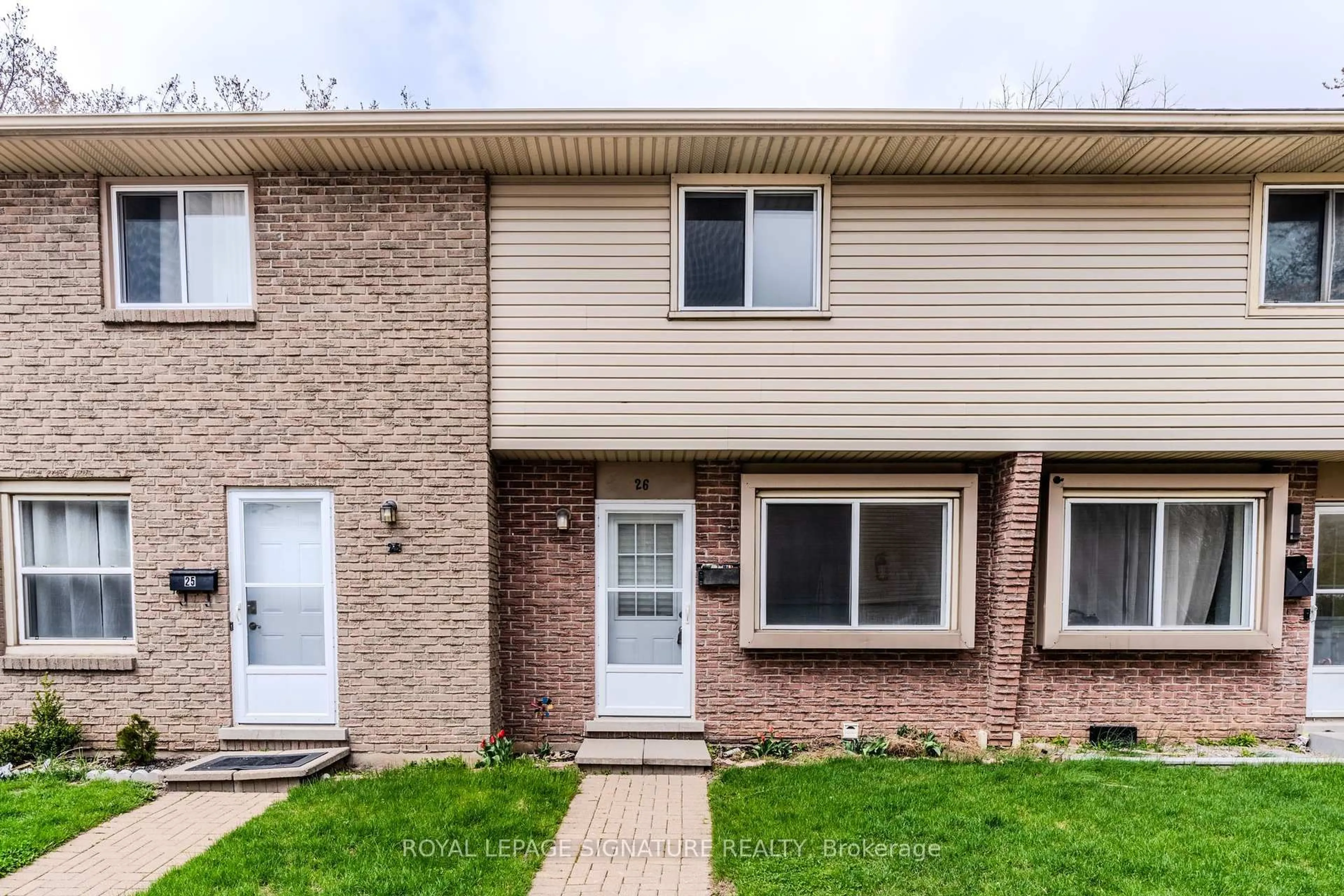 Home with brick exterior material, street for 293 Fairway Rd #26, Kitchener Ontario N2A 2P1