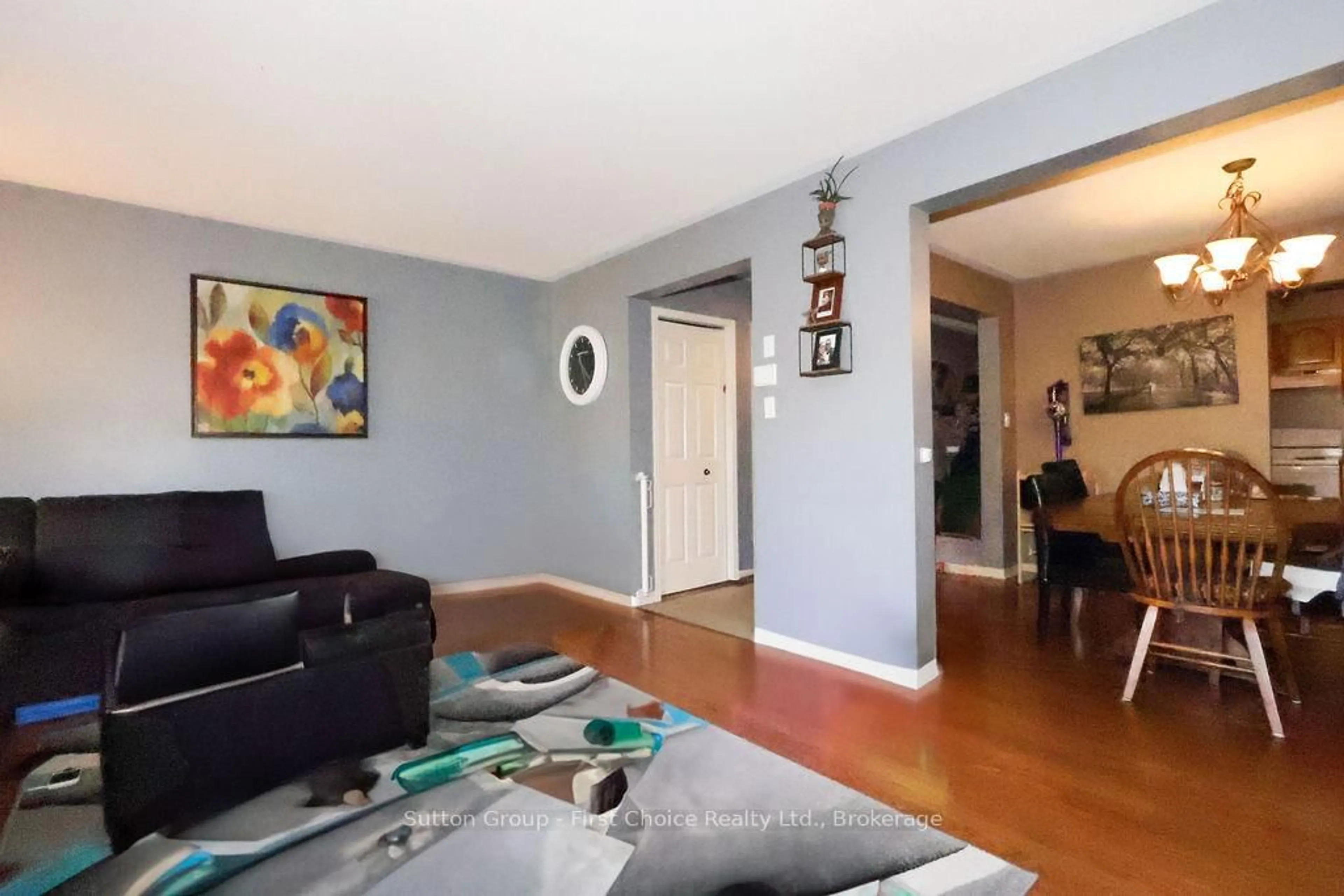 Living room with furniture, wood/laminate floor for 429 Greenwood Dr, Stratford Ontario N5A 7S7