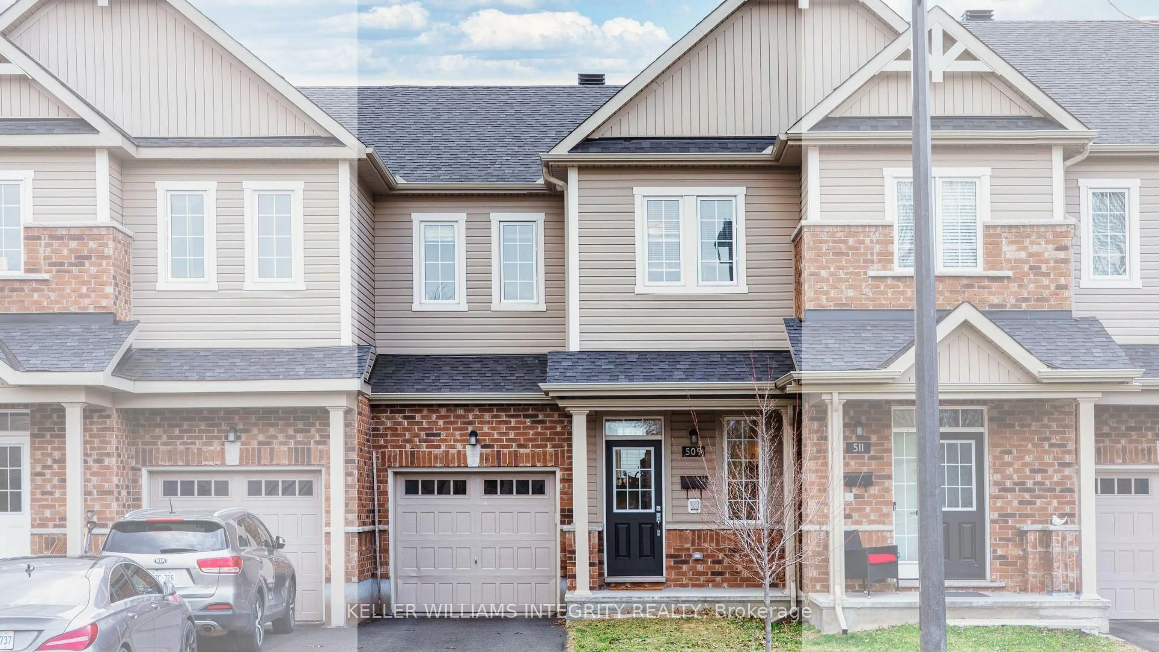 Home with brick exterior material, street for 509 Tulip Tree Way, Ottawa Ontario K1W 0L8