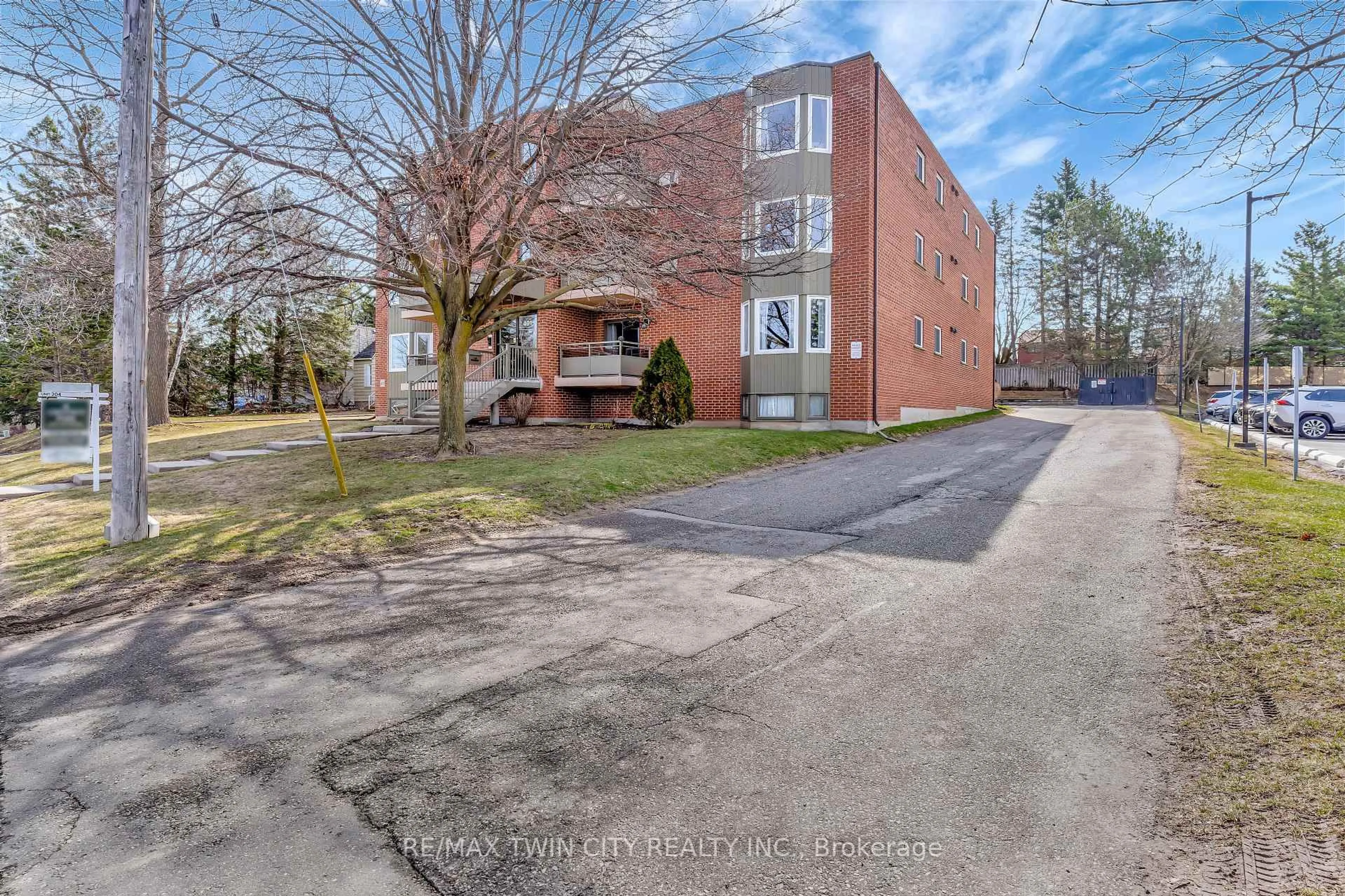 A pic from outside/outdoor area/front of a property/back of a property/a pic from drone, street for 401 Erb St #203, Waterloo Ontario N2L 1W7
