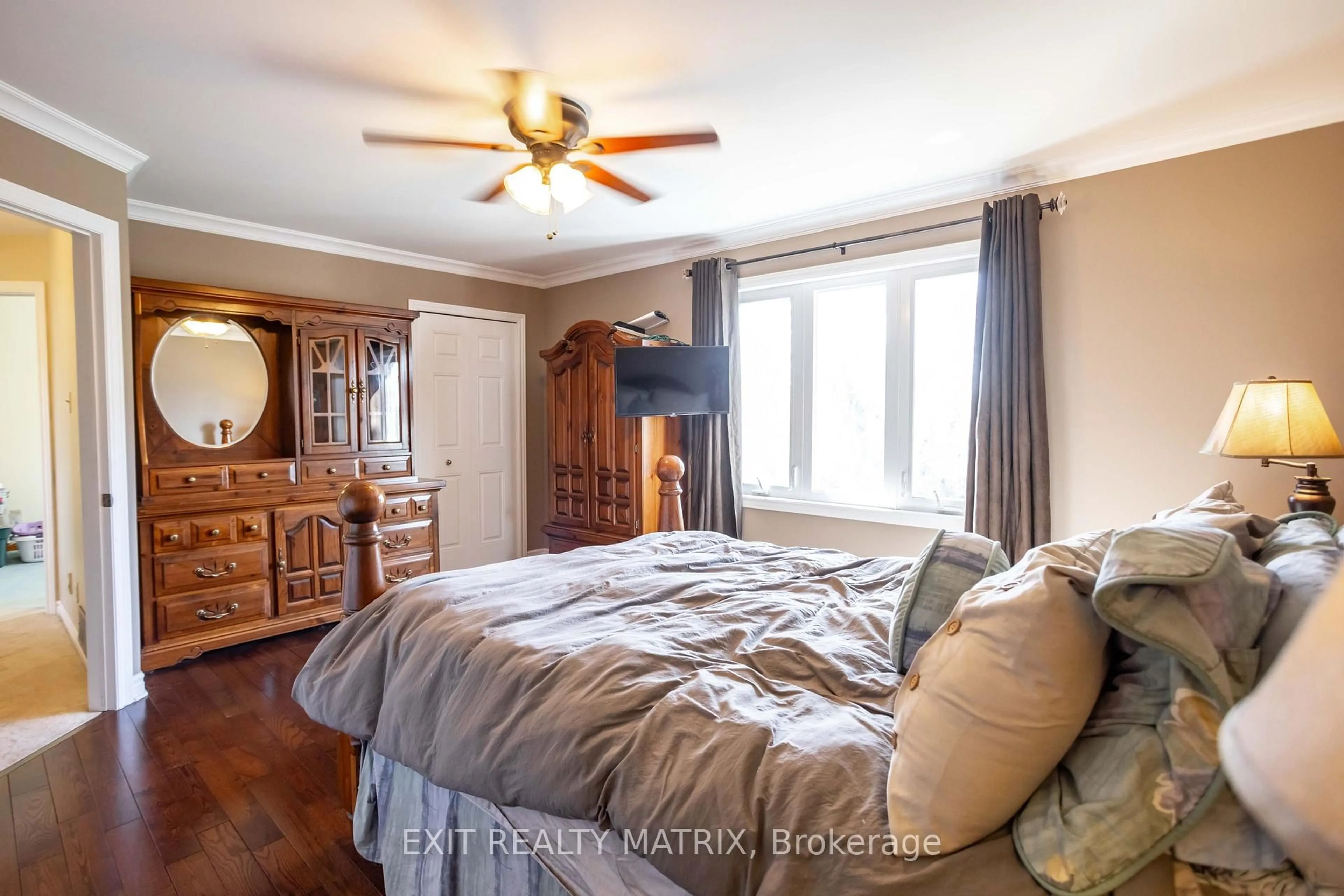 Bedroom with bed, wood/laminate floor for 21 Desnoyers St, Casselman Ontario K0A 1M0