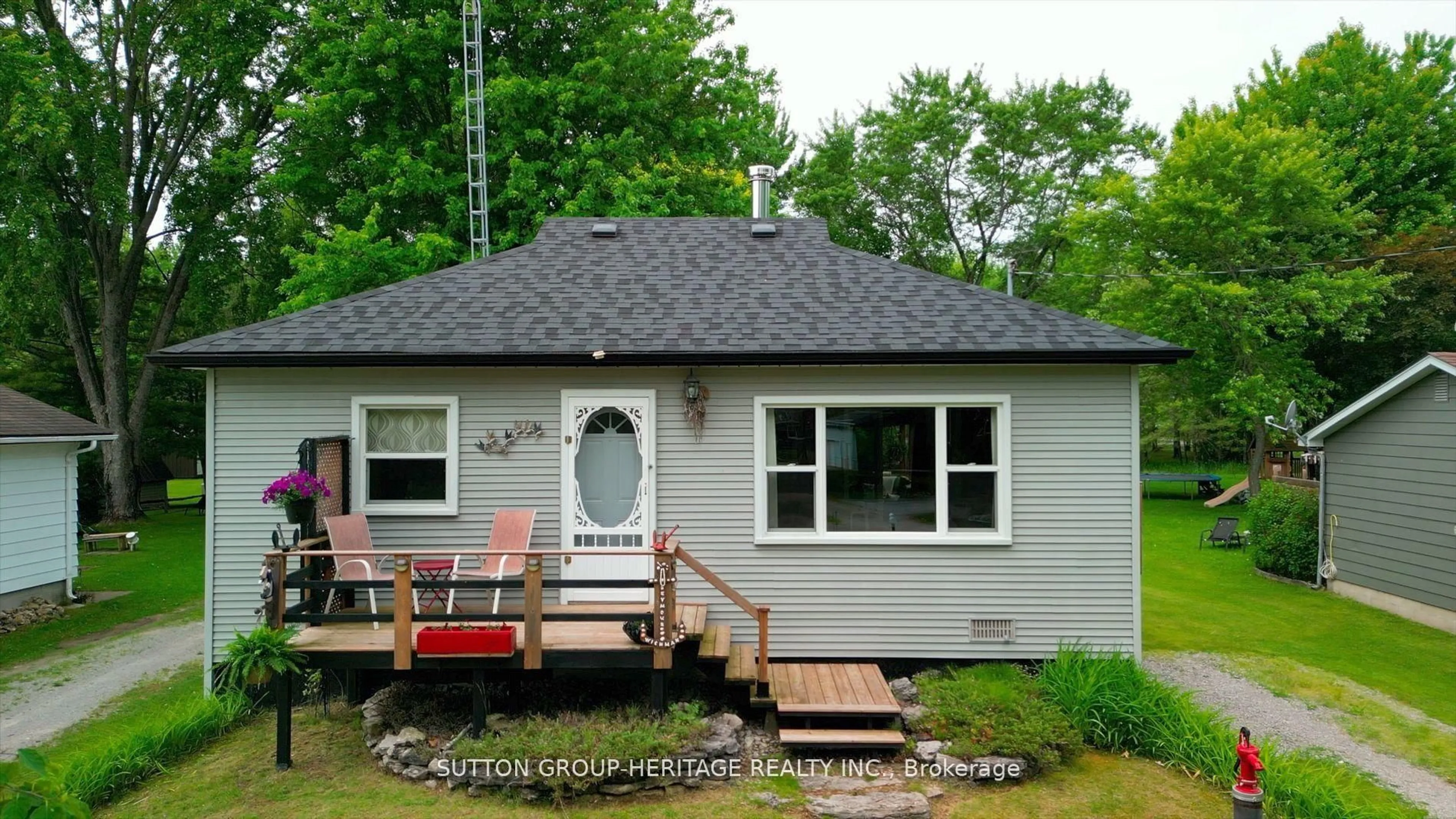 Home with vinyl exterior material, street for 15 Sackitt Rd, Kawartha Lakes Ontario K0M 1N0