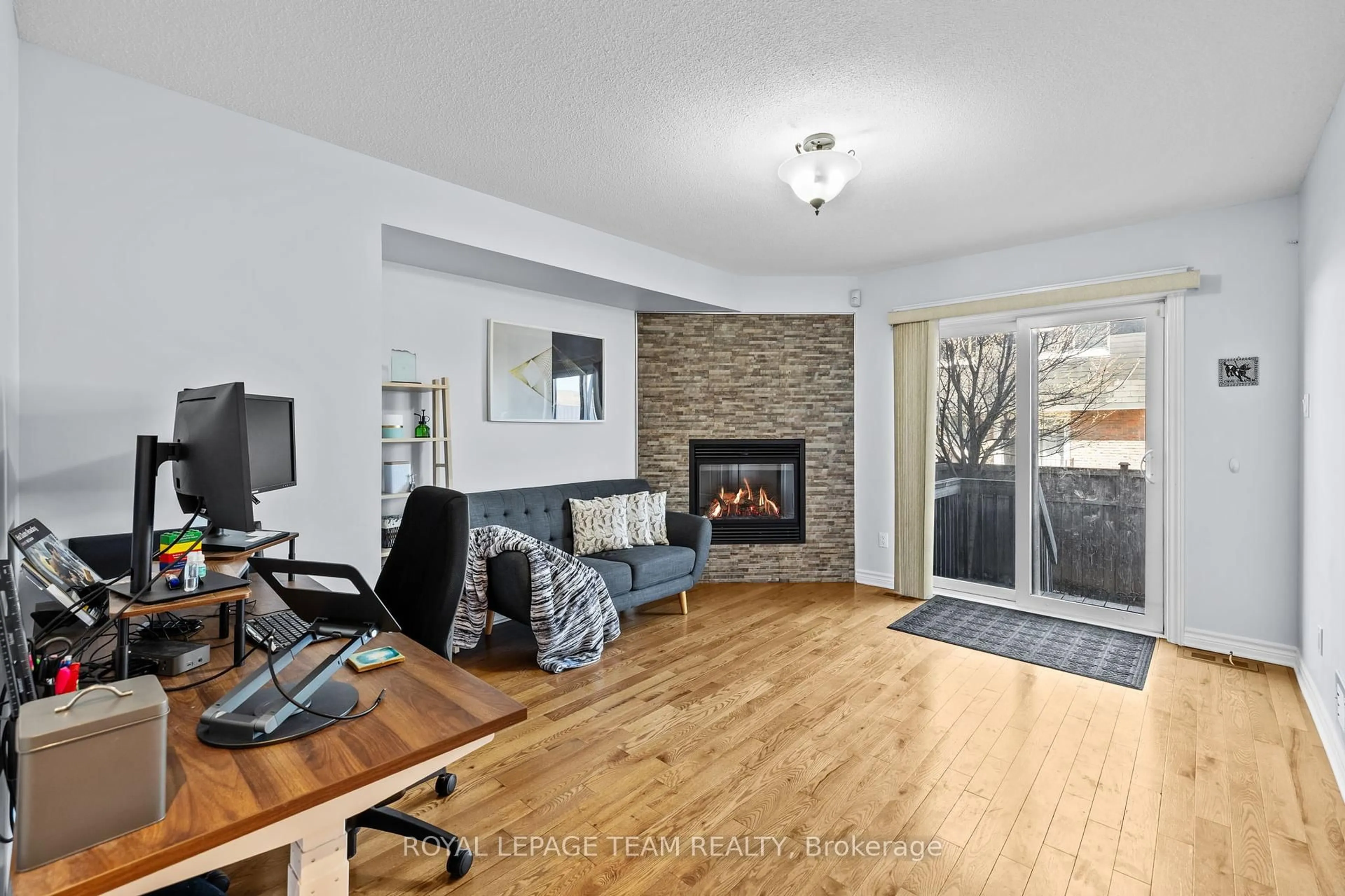 Living room with furniture, wood/laminate floor for 125 Brilia Private, Ottawa Ontario K1J 0B7