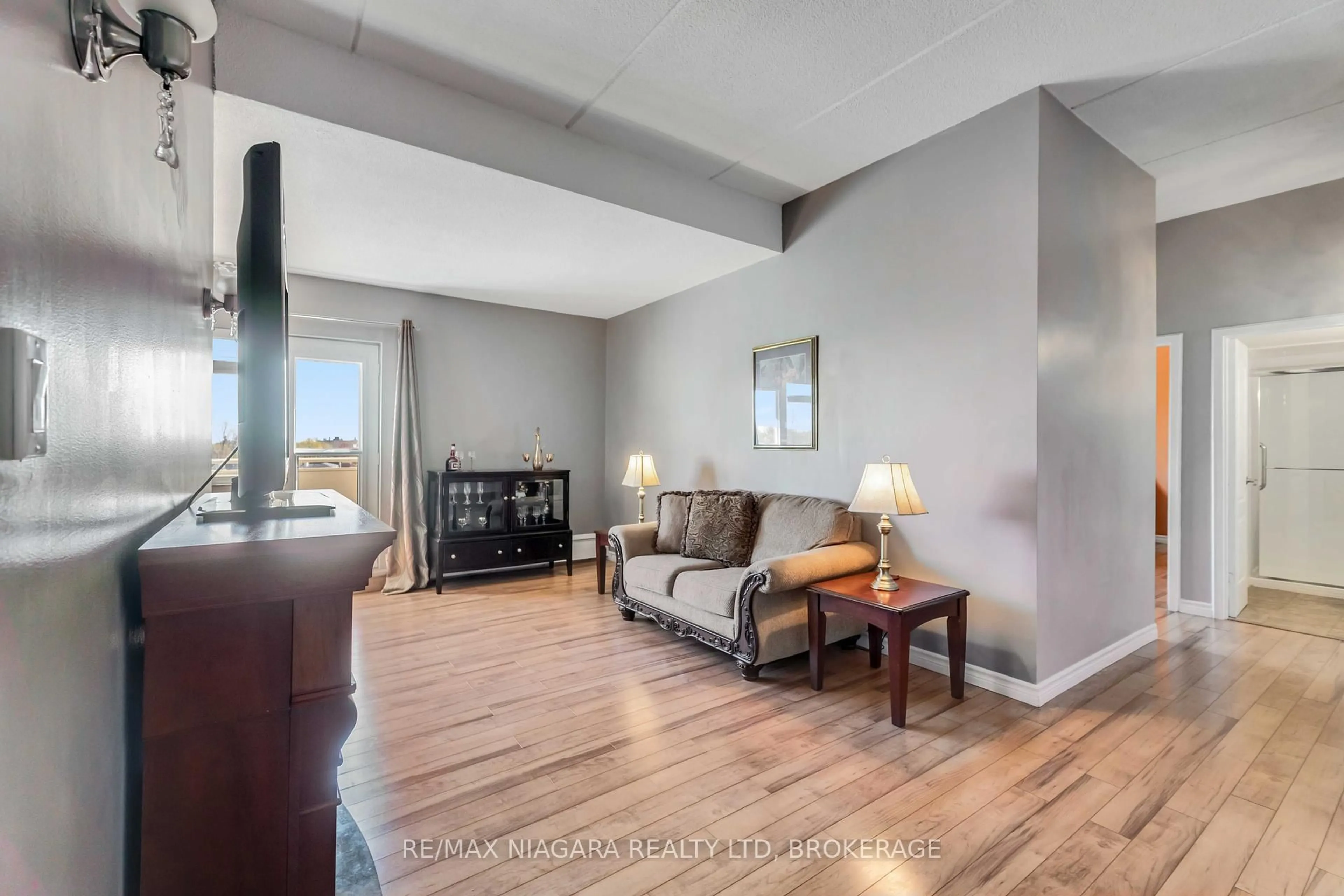 Living room with furniture, unknown for 198 Scott St #506, St. Catharines Ontario L2N 5T3